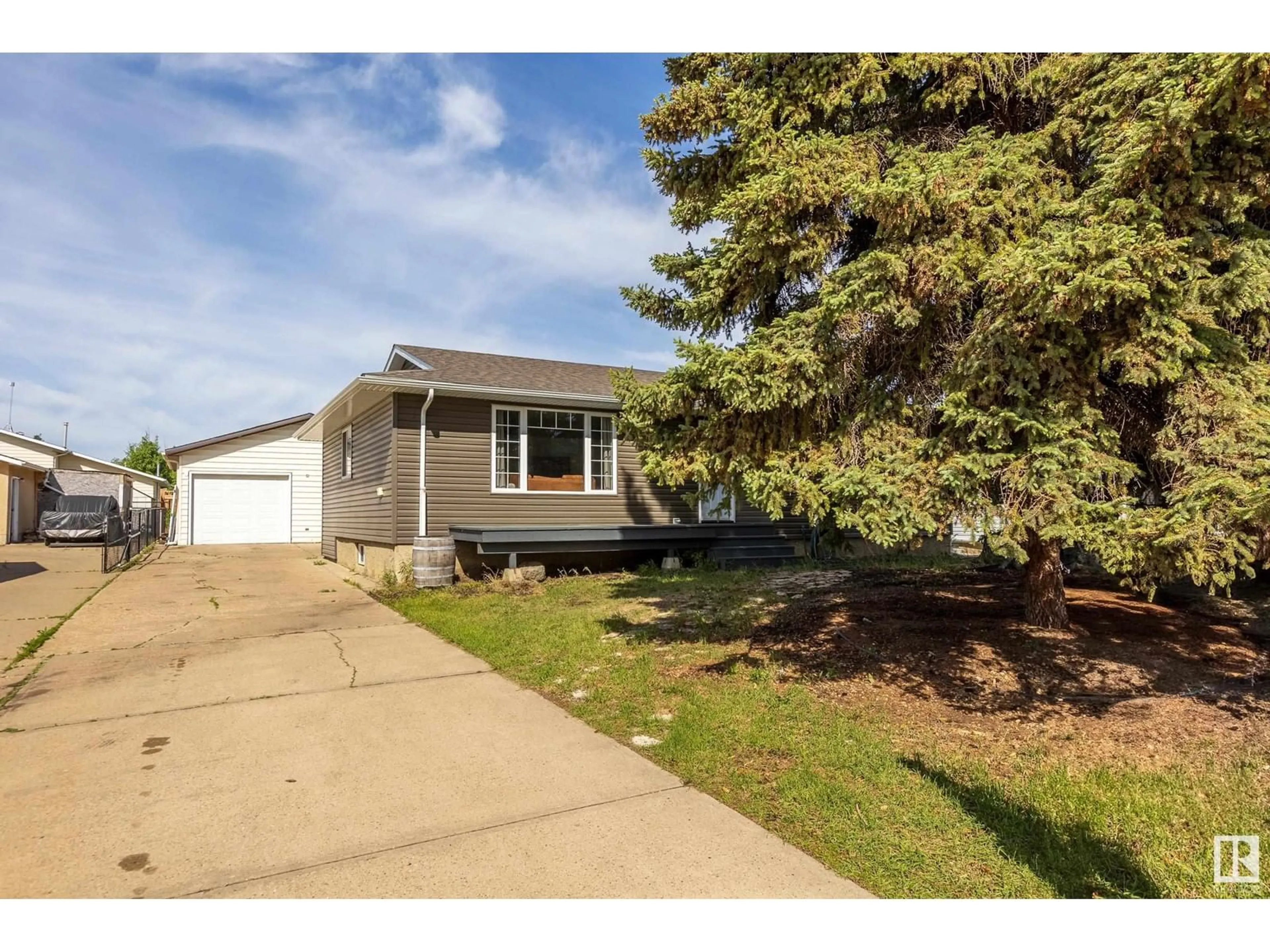 Home with vinyl exterior material, street for 9708 MORINVILLE DR, Morinville Alberta T8R1J2