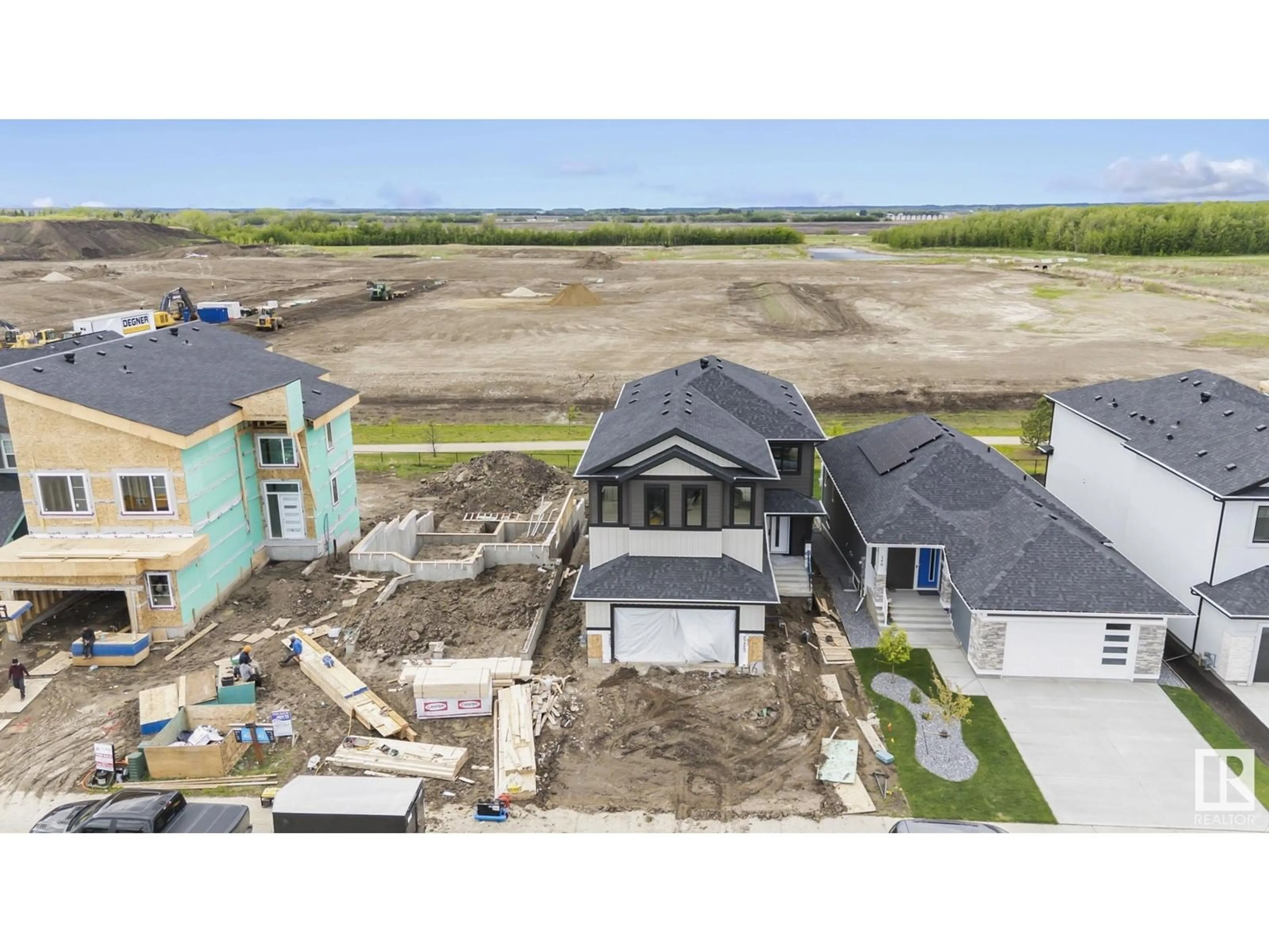 A pic from outside/outdoor area/front of a property/back of a property/a pic from drone, water/lake/river/ocean view for 146 EDGEWATER CI, Leduc Alberta T9E1K5