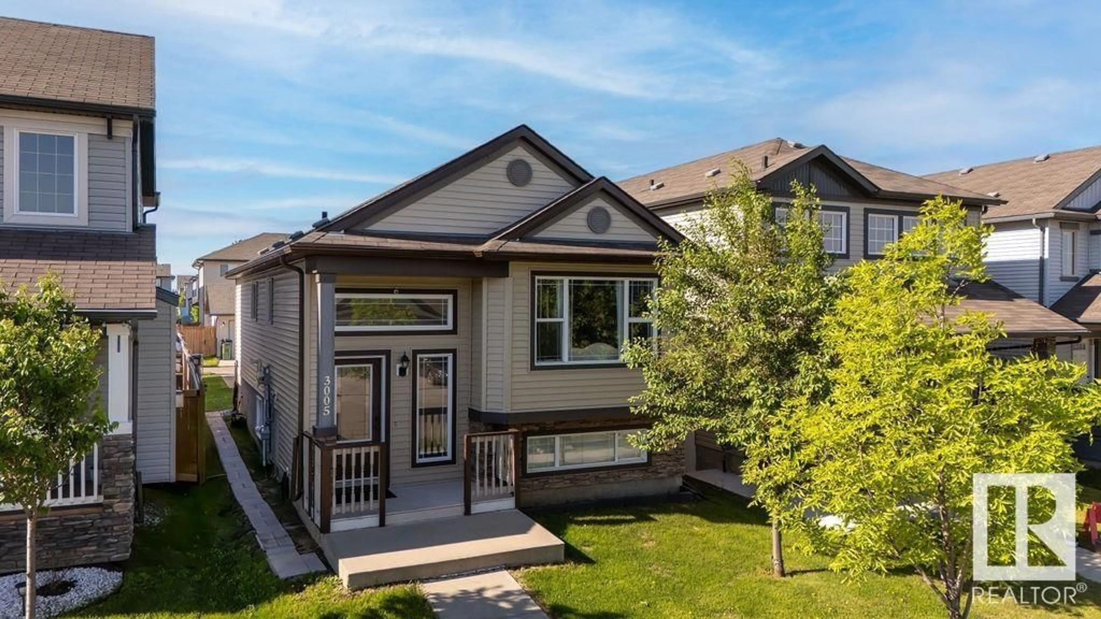 Home with vinyl exterior material, street for 3005 17A AV, Edmonton Alberta T6T0R8