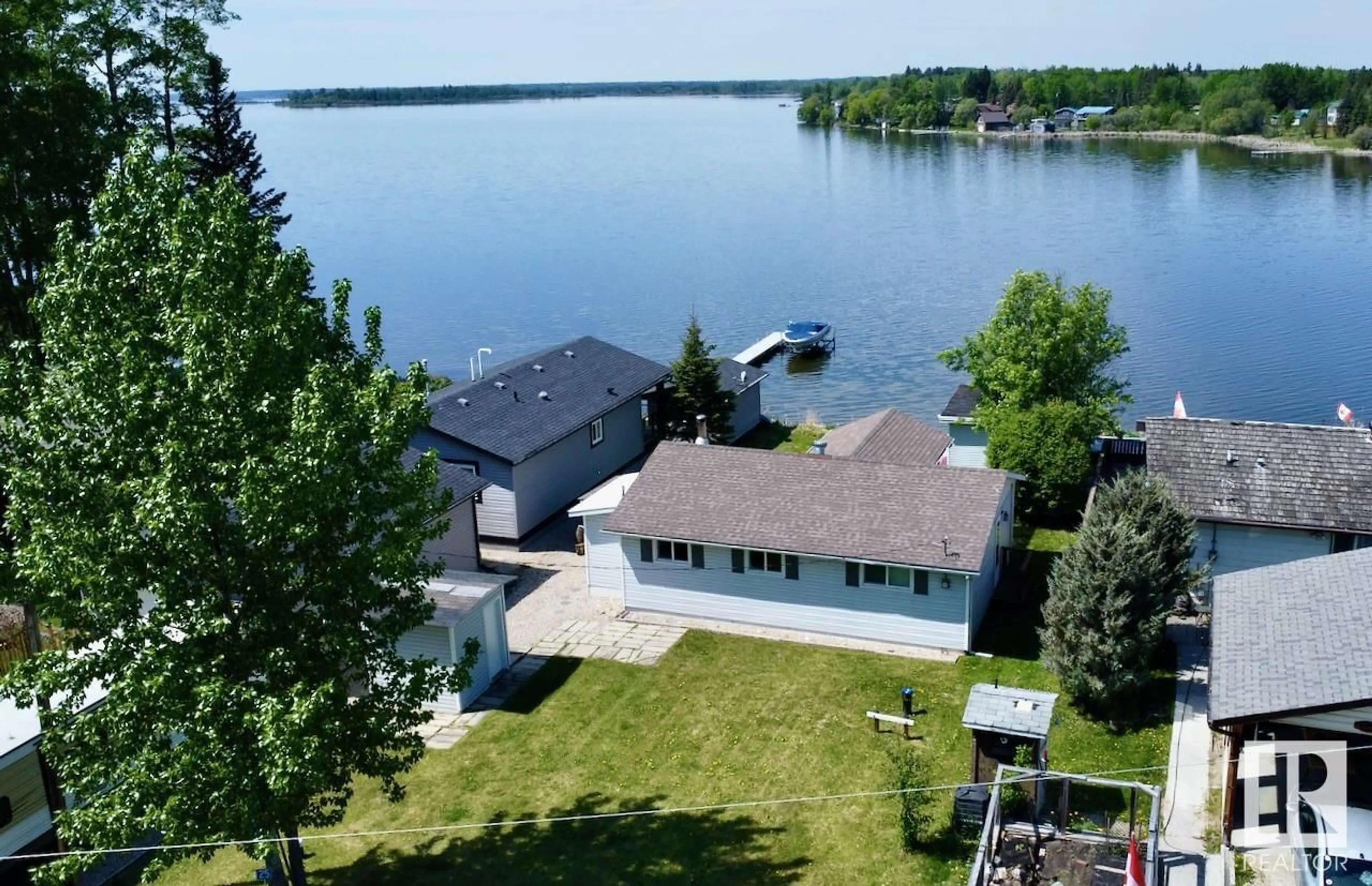 A pic from outside/outdoor area/front of a property/back of a property/a pic from drone, water/lake/river/ocean view for 54114 - 25 RGE ROAD 52, Rural Lac Ste. Anne County Alberta T0E1H0