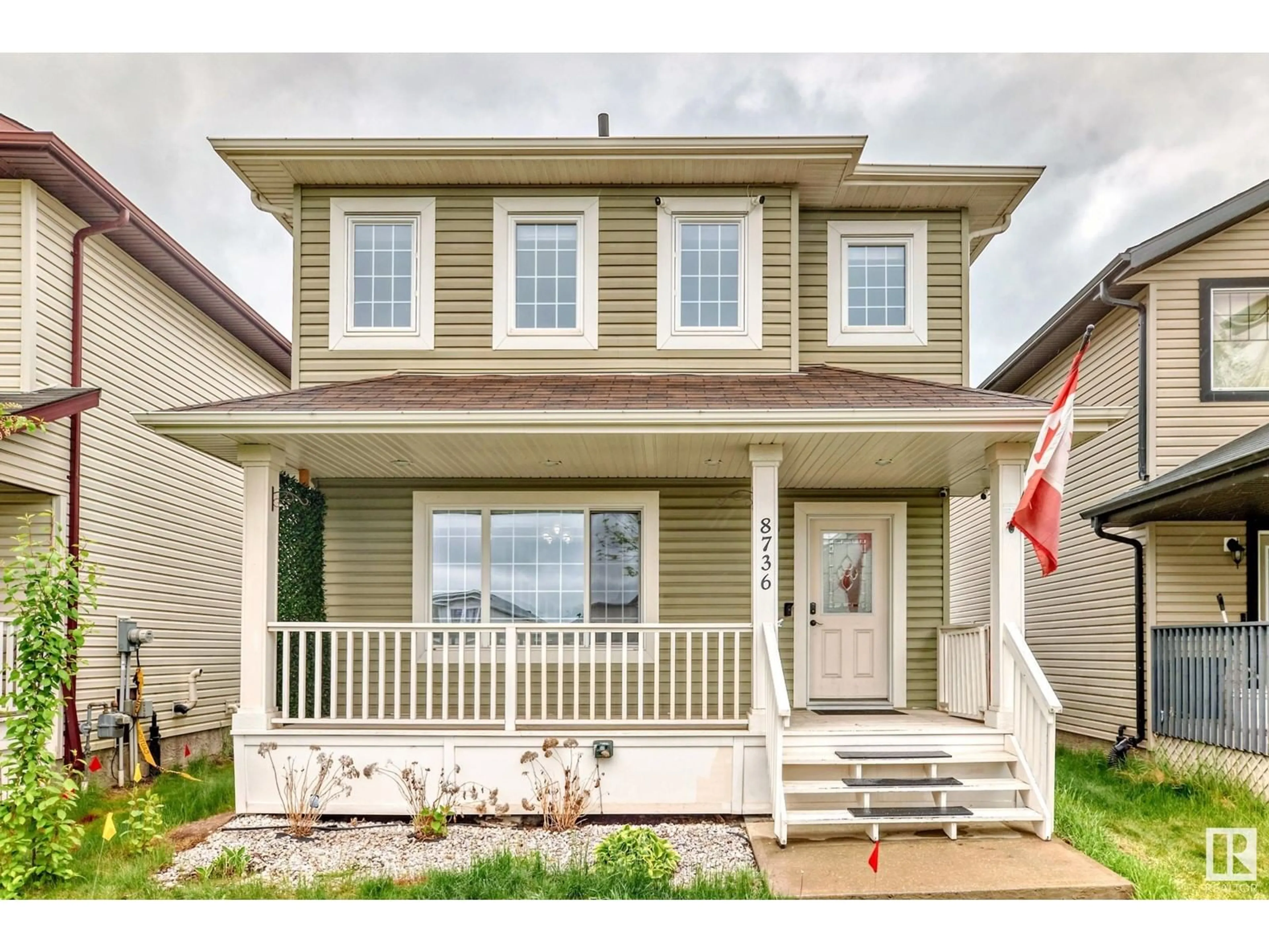 Home with vinyl exterior material, street for NW - 8736 180 AV, Edmonton Alberta T5Z0E3