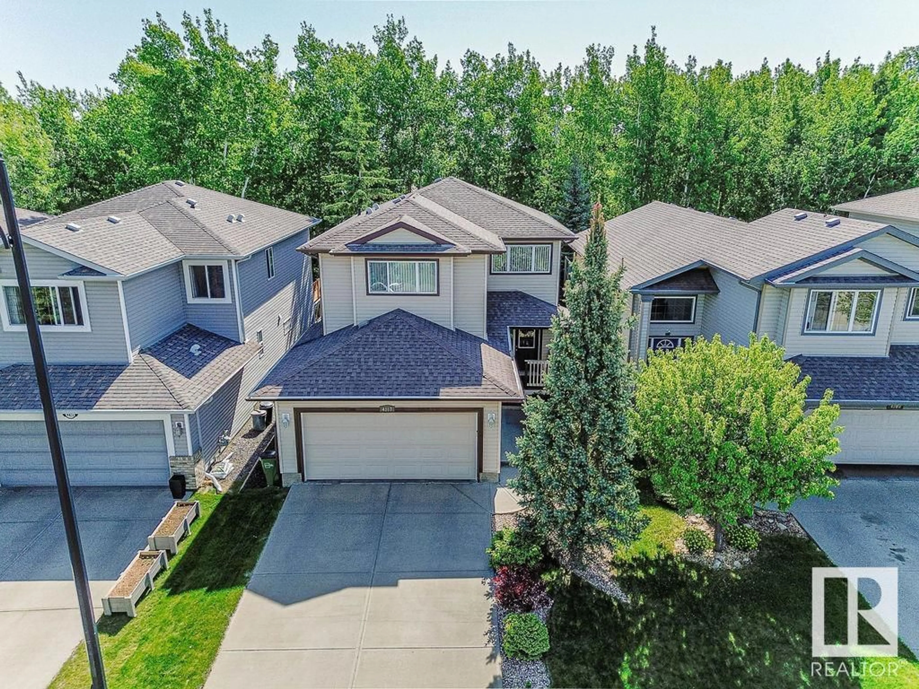A pic from outside/outdoor area/front of a property/back of a property/a pic from drone, unknown for NW - 4807 213 ST, Edmonton Alberta T6M0G7