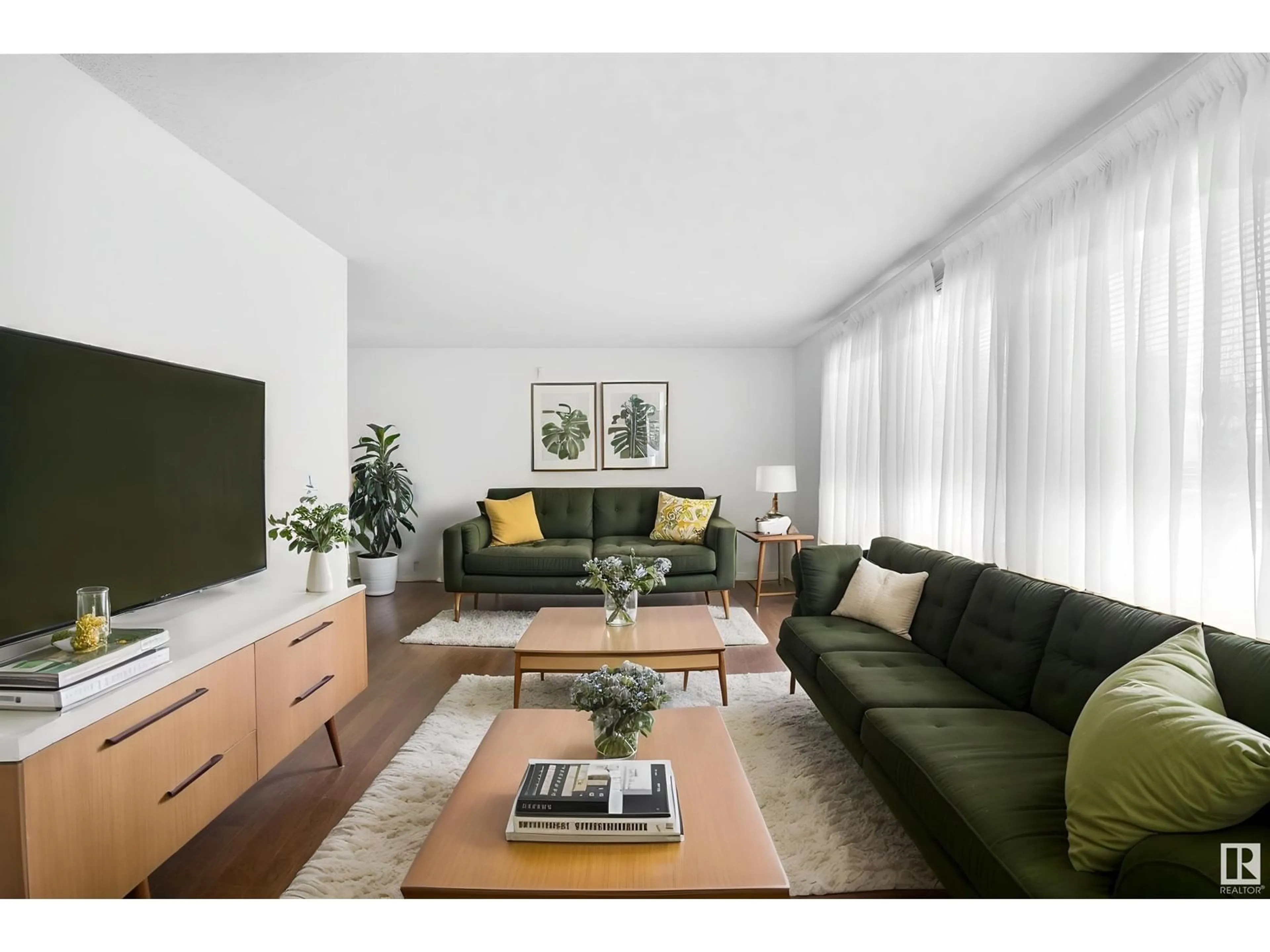 Living room with furniture, wood/laminate floor for NW - 4120 135 AV, Edmonton Alberta T5A2N7
