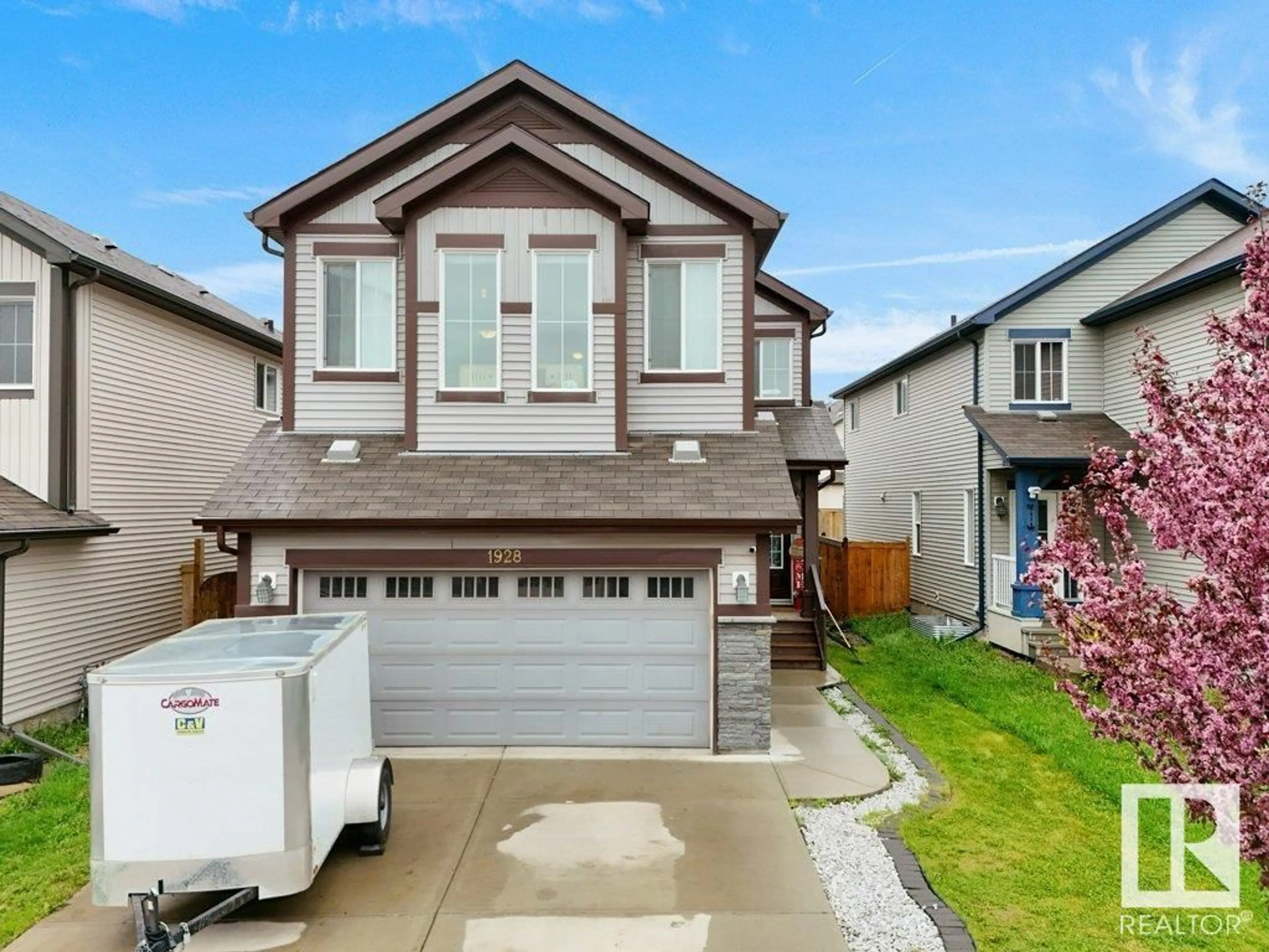 Home with vinyl exterior material, street for SW - 1928 51 ST, Edmonton Alberta T6X1Y4