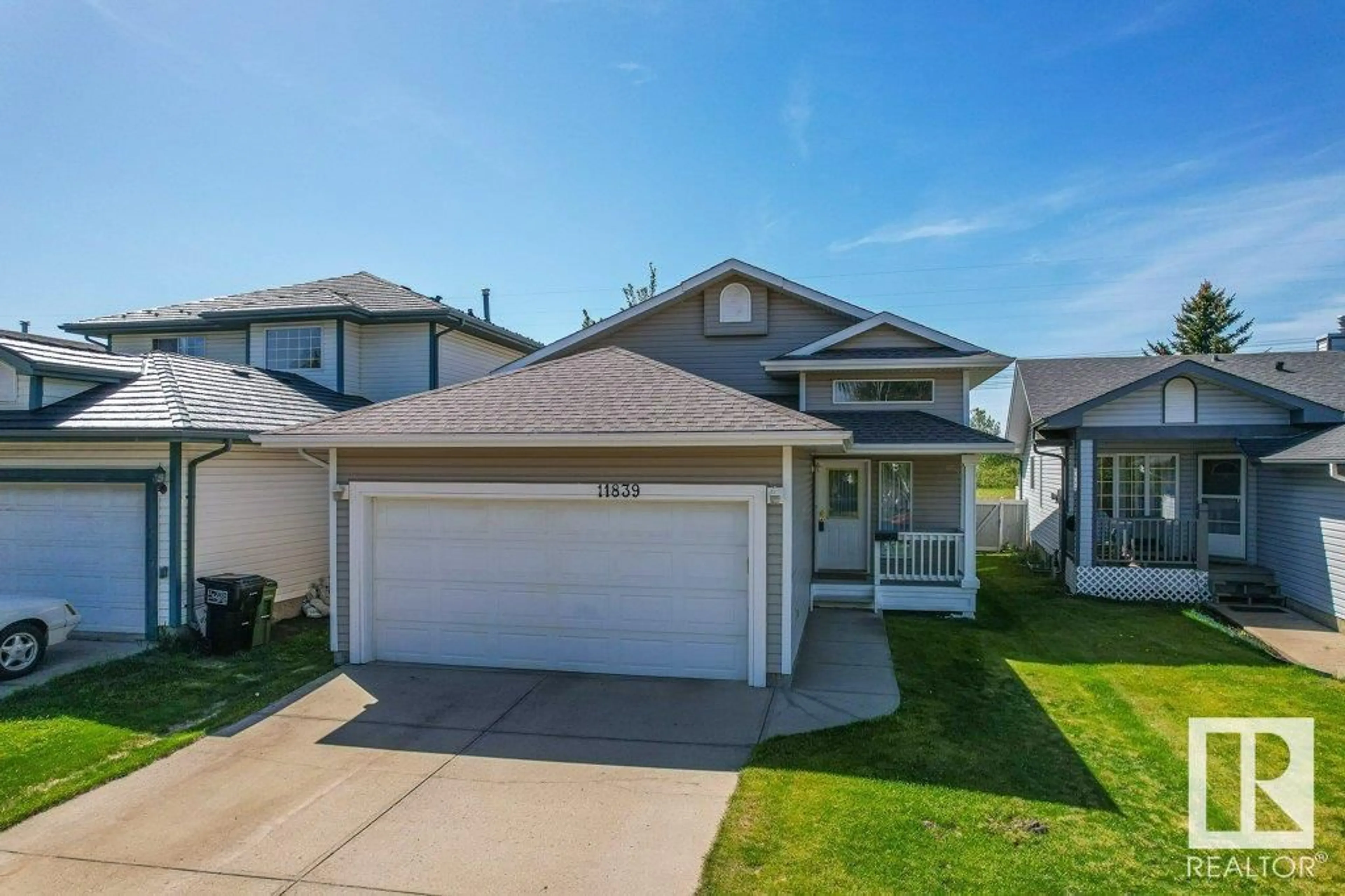 Home with vinyl exterior material, street for 11839 8 AV, Edmonton Alberta T6J6Z9