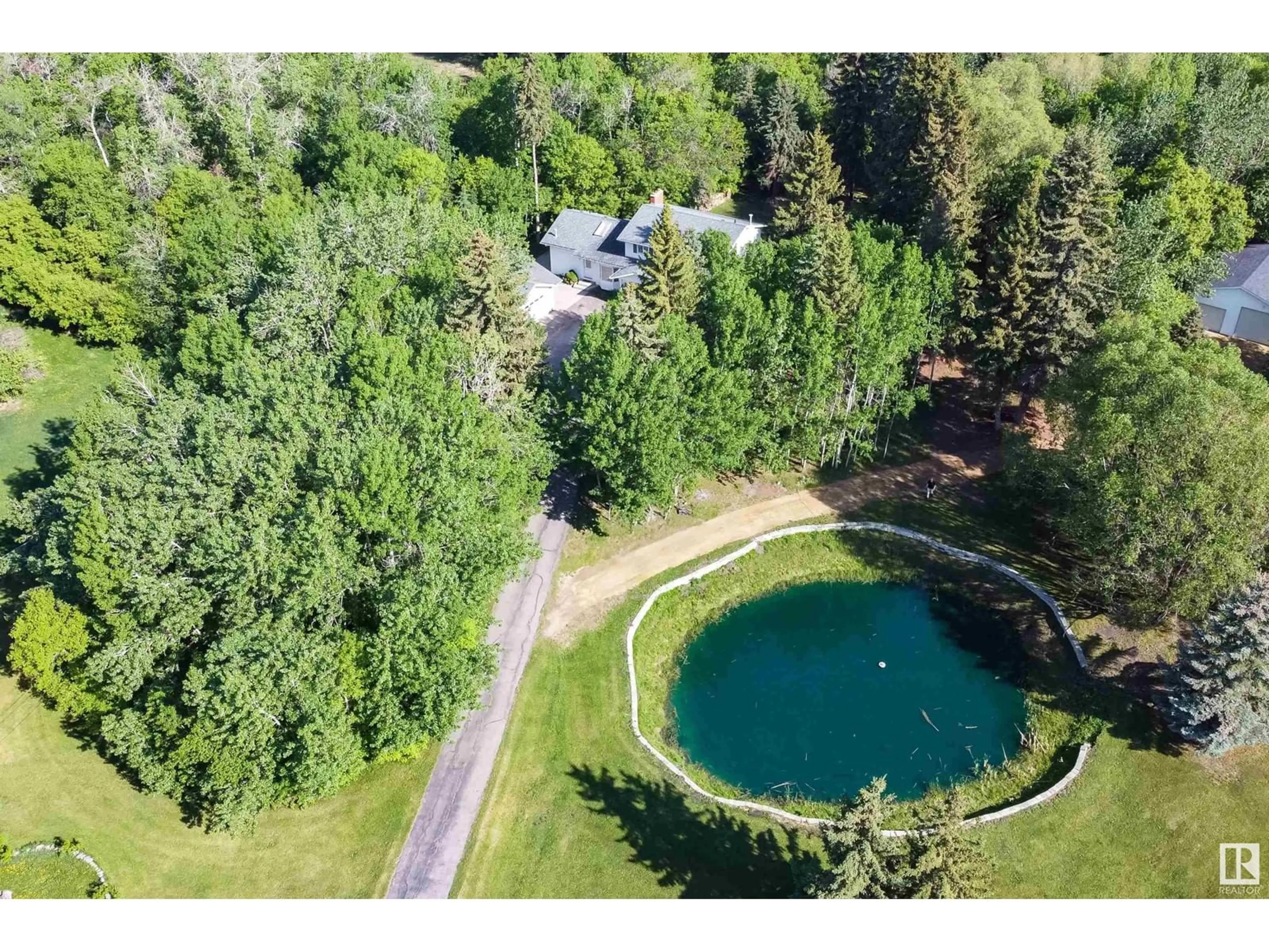 A pic from outside/outdoor area/front of a property/back of a property/a pic from drone, water/lake/river/ocean view for 232 - 253 52310 RGE ROAD, Rural Strathcona County Alberta T8B1C2
