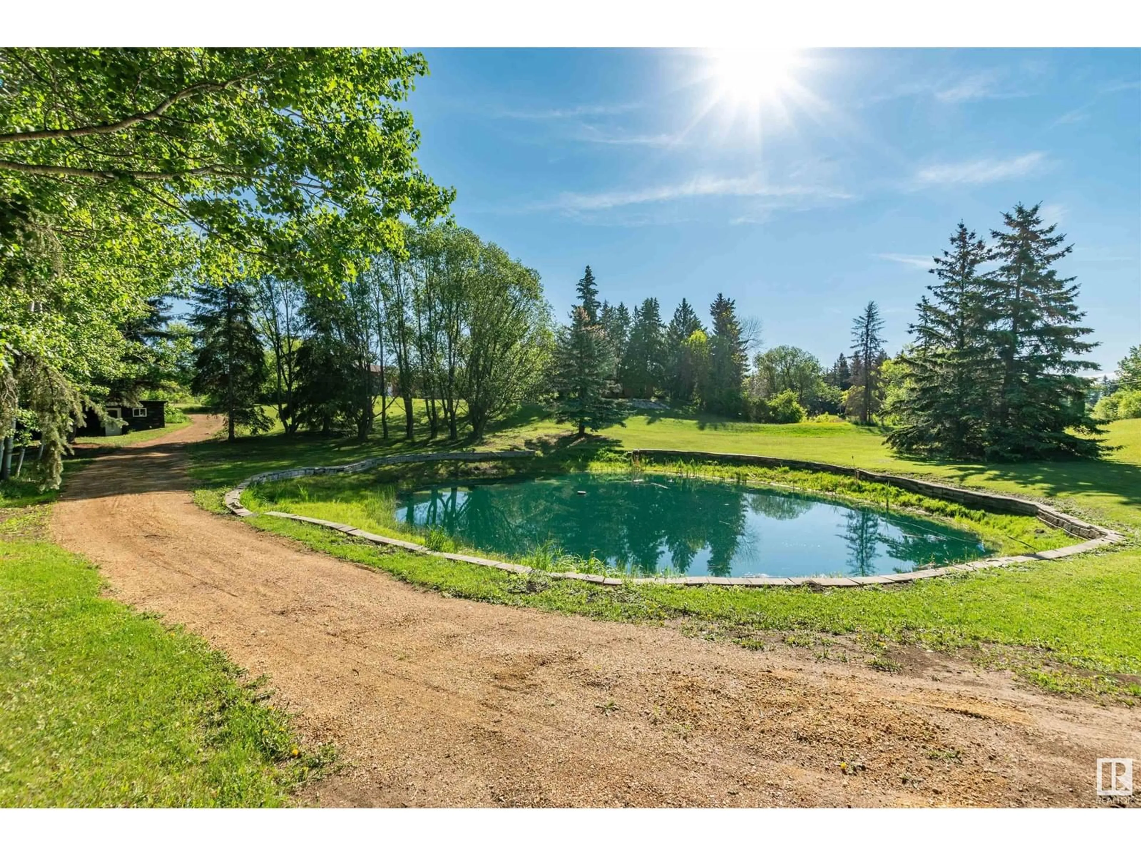 A pic from outside/outdoor area/front of a property/back of a property/a pic from drone, water/lake/river/ocean view for 232 - 253 52310 RGE ROAD, Rural Strathcona County Alberta T8B1C2