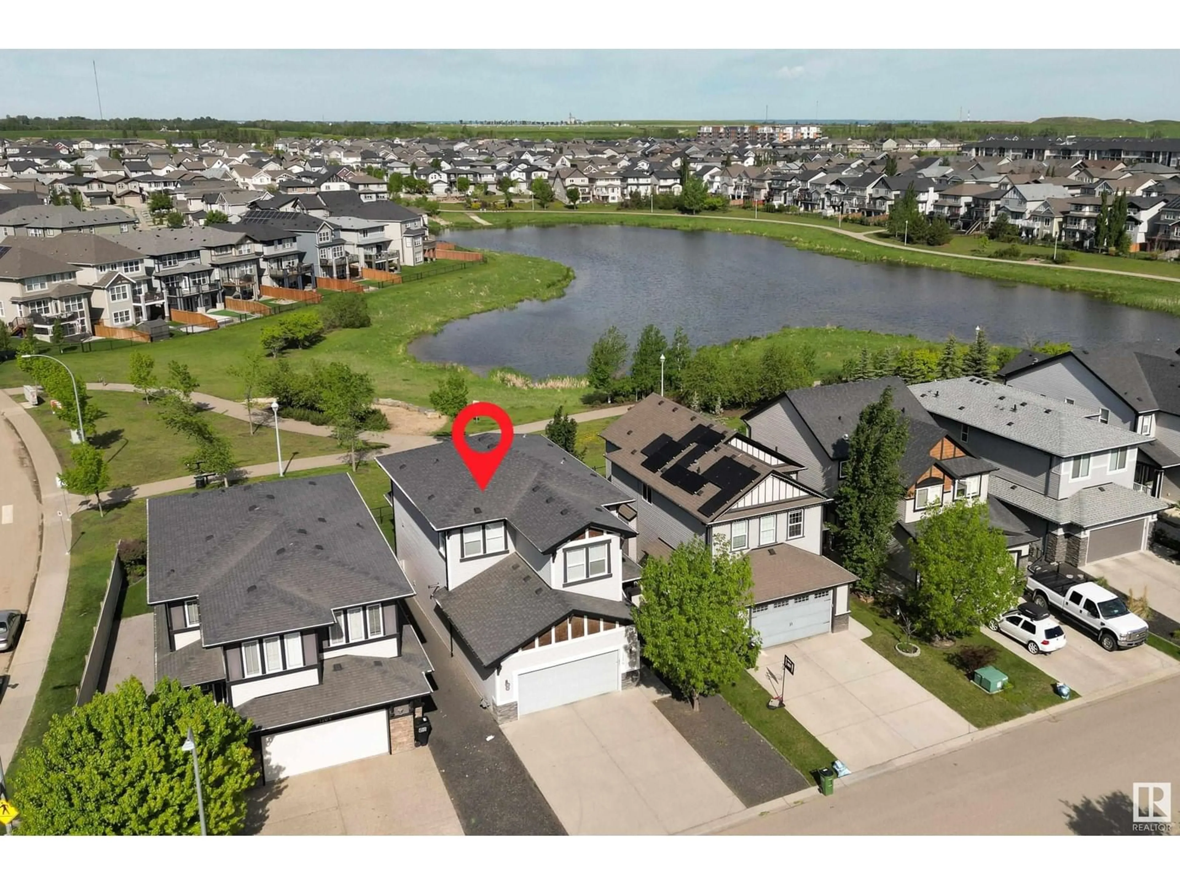 A pic from outside/outdoor area/front of a property/back of a property/a pic from drone, water/lake/river/ocean view for NW - 1206 SECORD LD, Edmonton Alberta T5T4N3