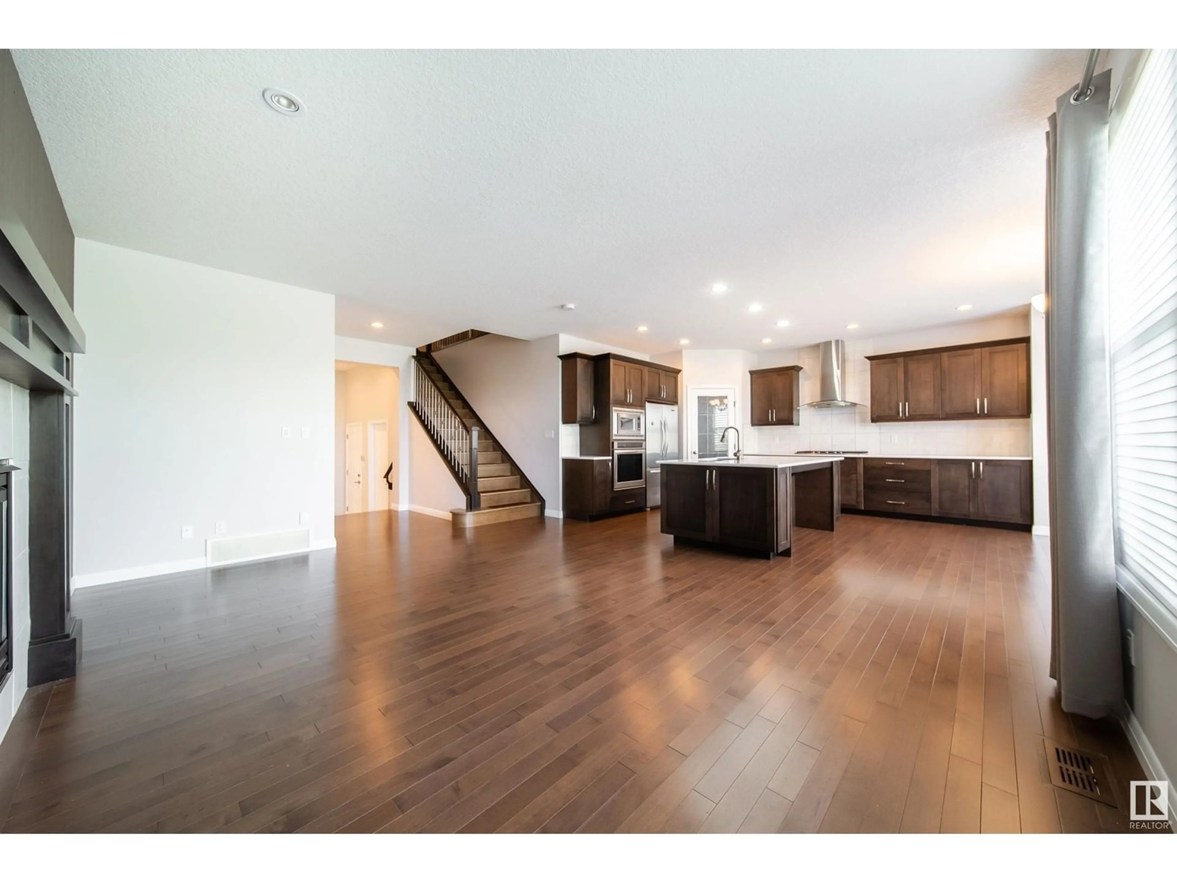 Open concept kitchen, wood/laminate floor for NW - 1206 SECORD LD, Edmonton Alberta T5T4N3