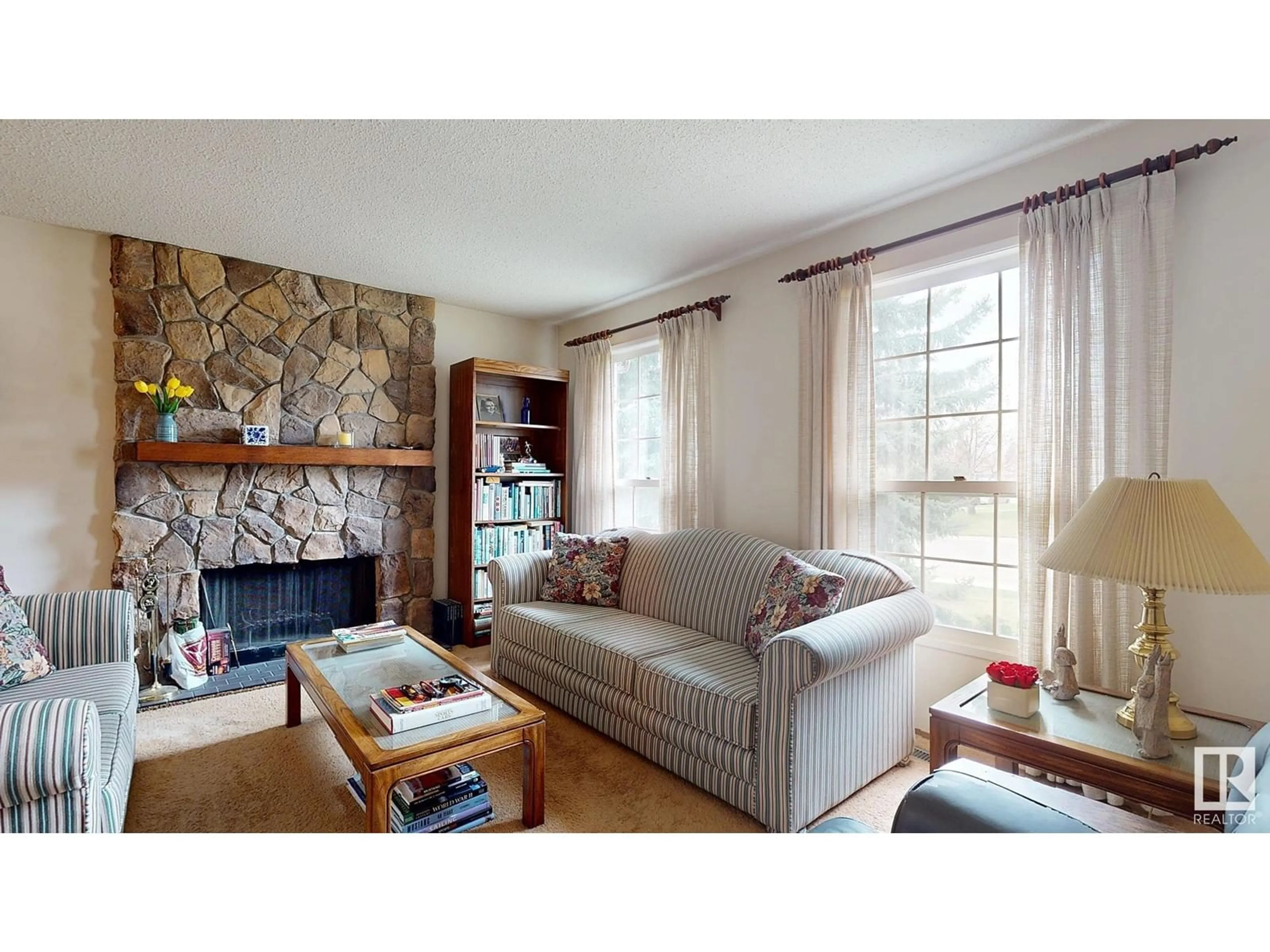 Living room with furniture, wood/laminate floor for 18504 71 AV, Edmonton Alberta T5T2S3