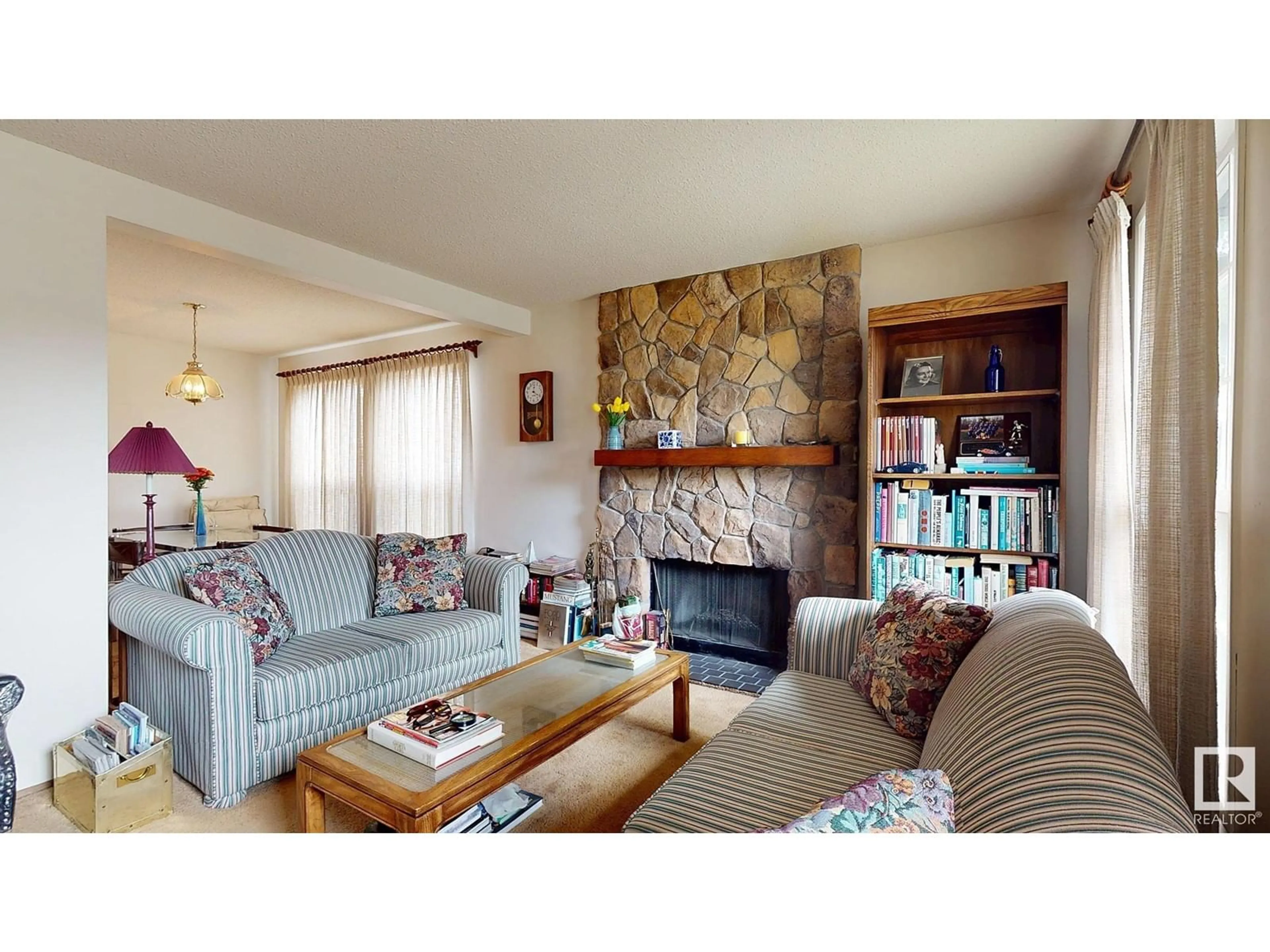 Living room with furniture, wood/laminate floor for 18504 71 AV, Edmonton Alberta T5T2S3