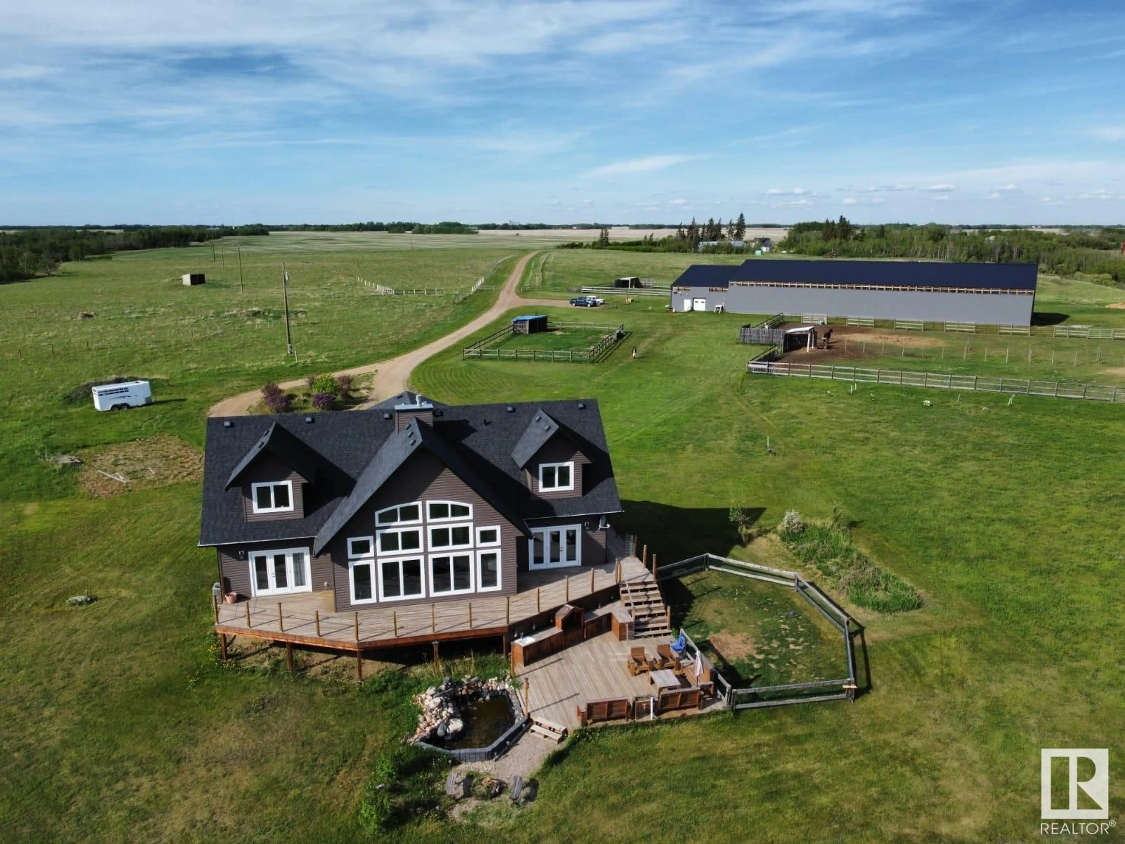 A pic from outside/outdoor area/front of a property/back of a property/a pic from drone, water/lake/river/ocean view for 20213 TOWNSHIP ROAD 460, Rural Camrose County Alberta T4V2M9