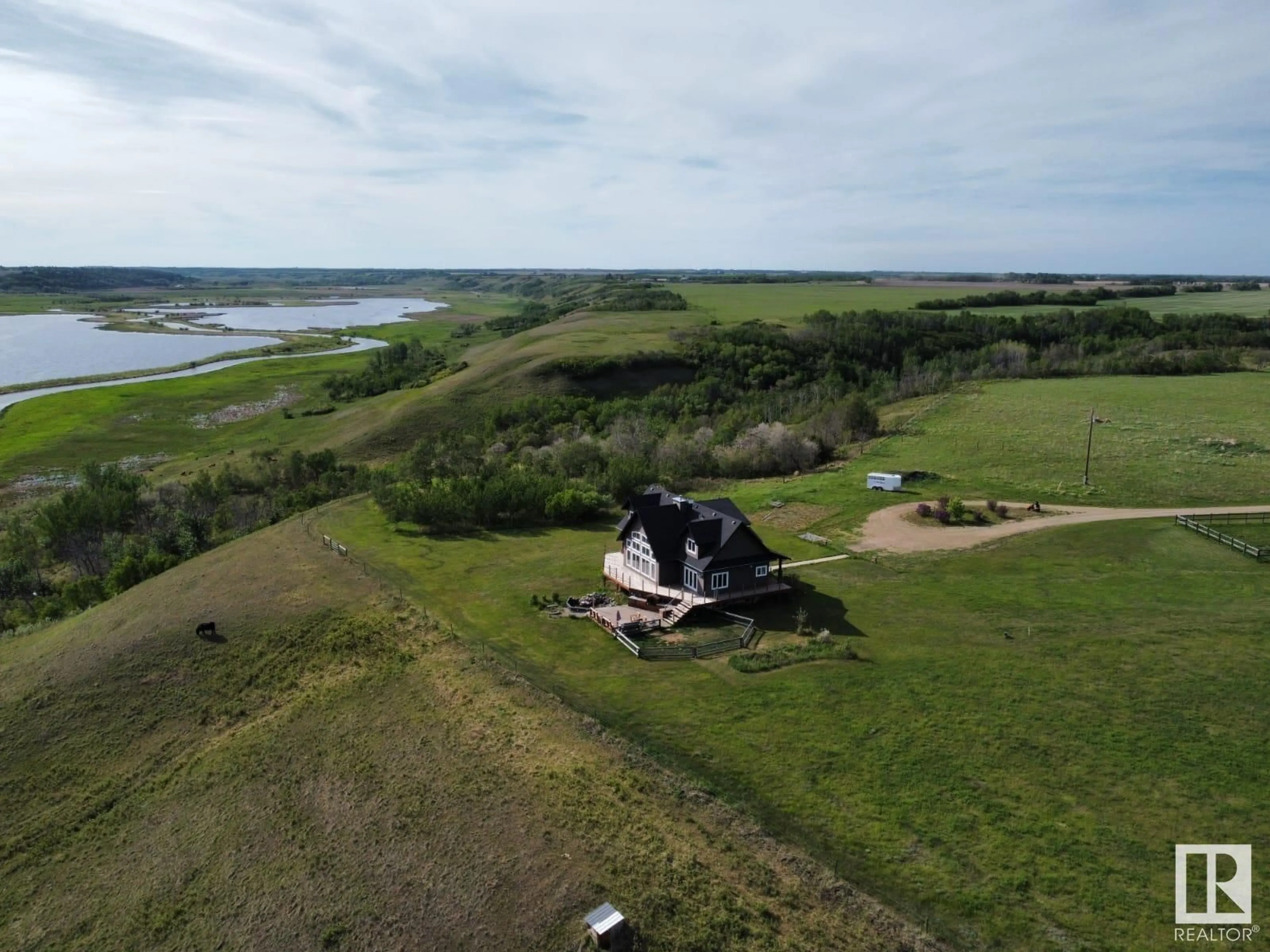 A pic from outside/outdoor area/front of a property/back of a property/a pic from drone, water/lake/river/ocean view for 20213 TOWNSHIP ROAD 460, Rural Camrose County Alberta T4V2M9