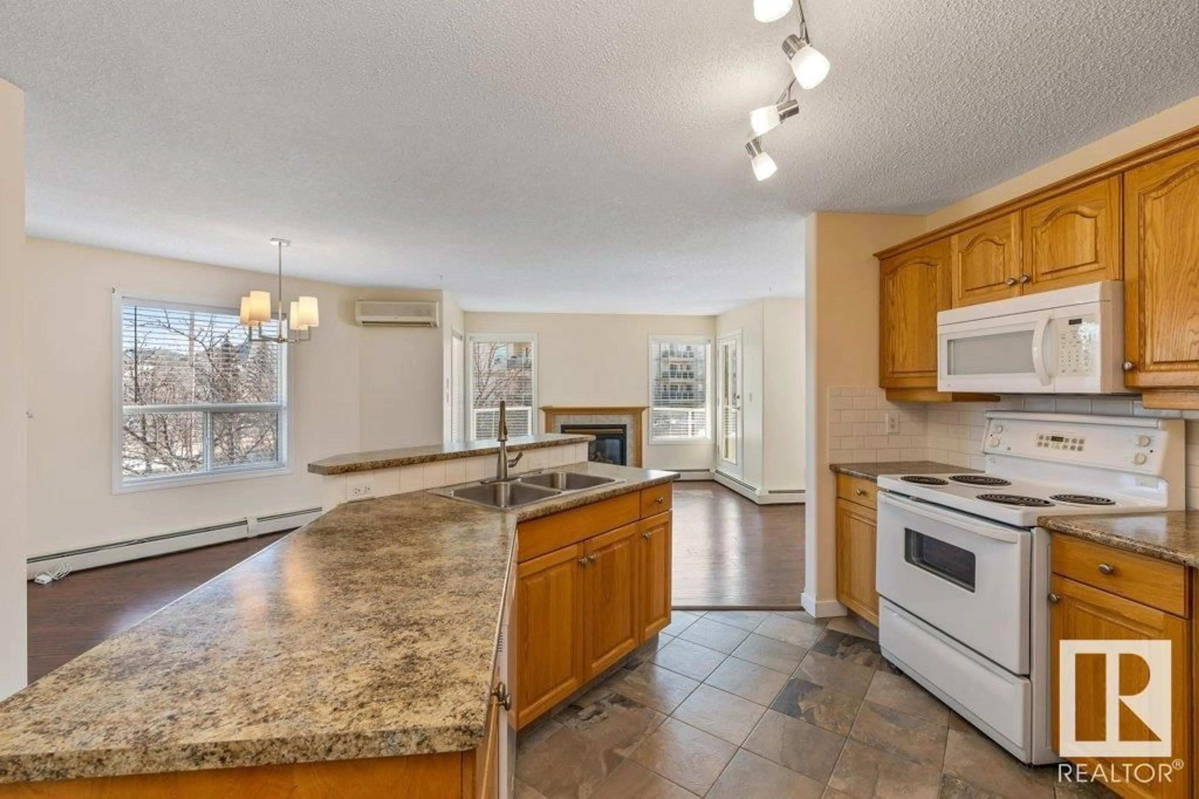 Open concept kitchen, ceramic/tile floor for 211 - 9760 174 ST, Edmonton Alberta T6T6J4