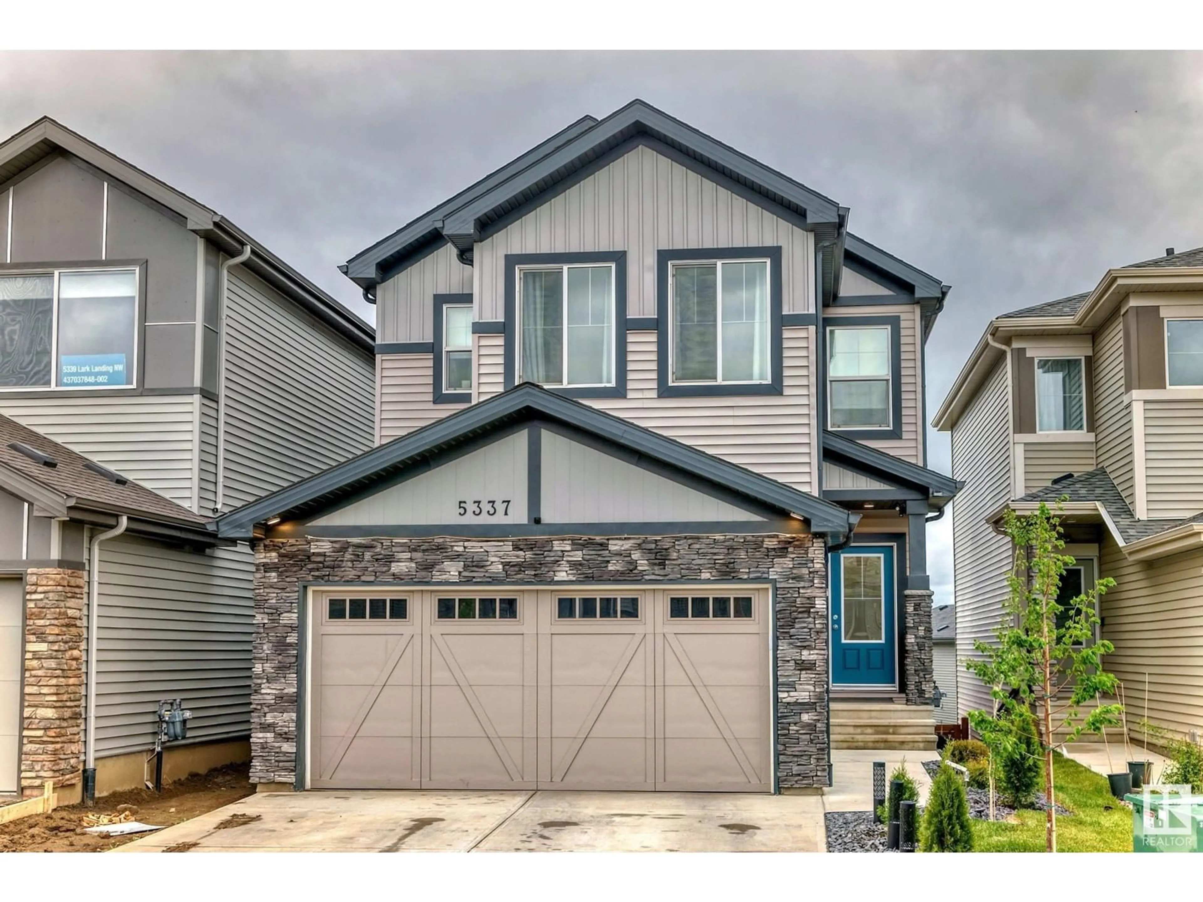 Home with vinyl exterior material, street for 5337 LARK LANDING NW, Edmonton Alberta T5S0P2