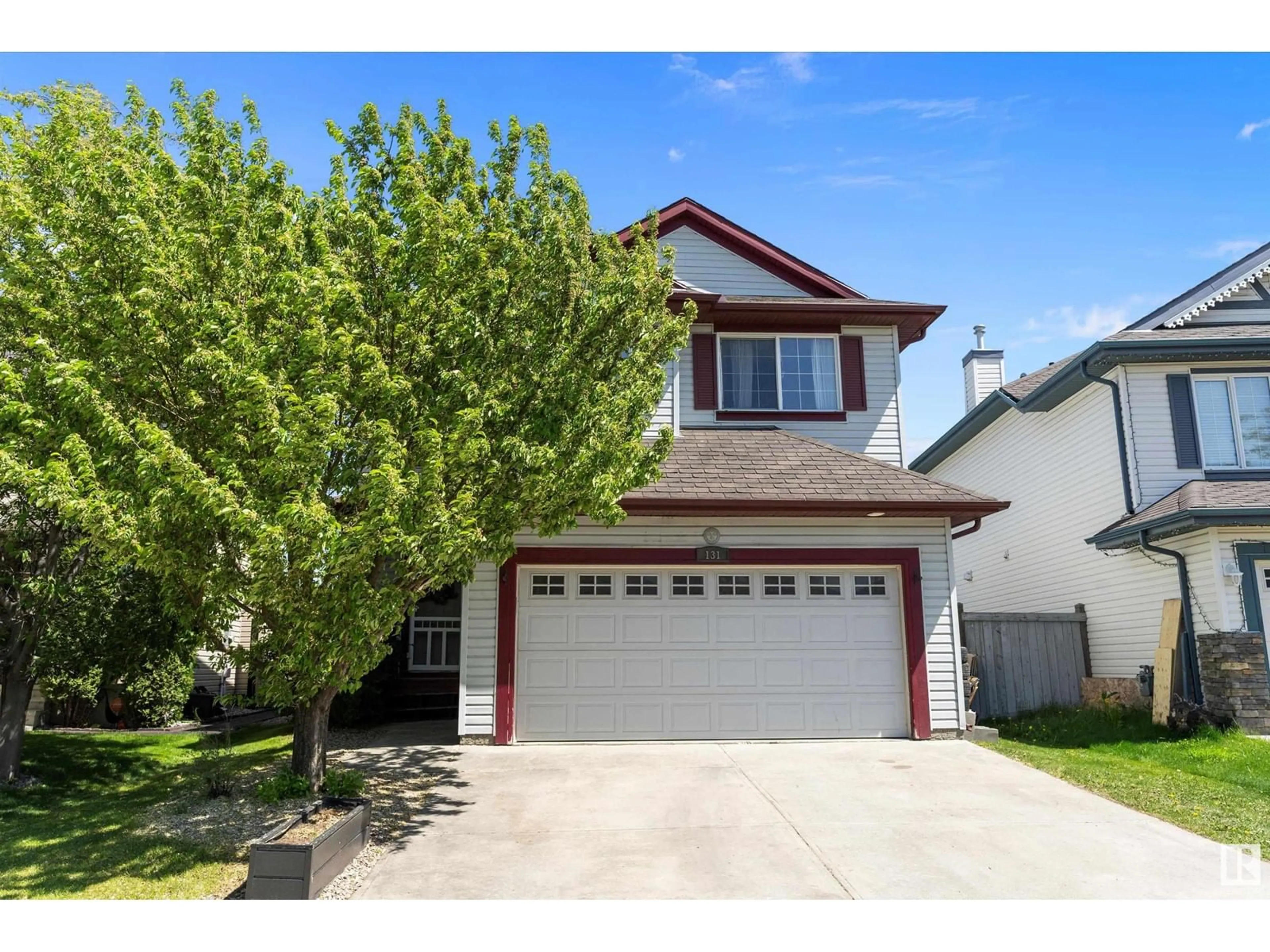 Home with vinyl exterior material, street for 131 RUE MASSON, Beaumont Alberta T4X1S8