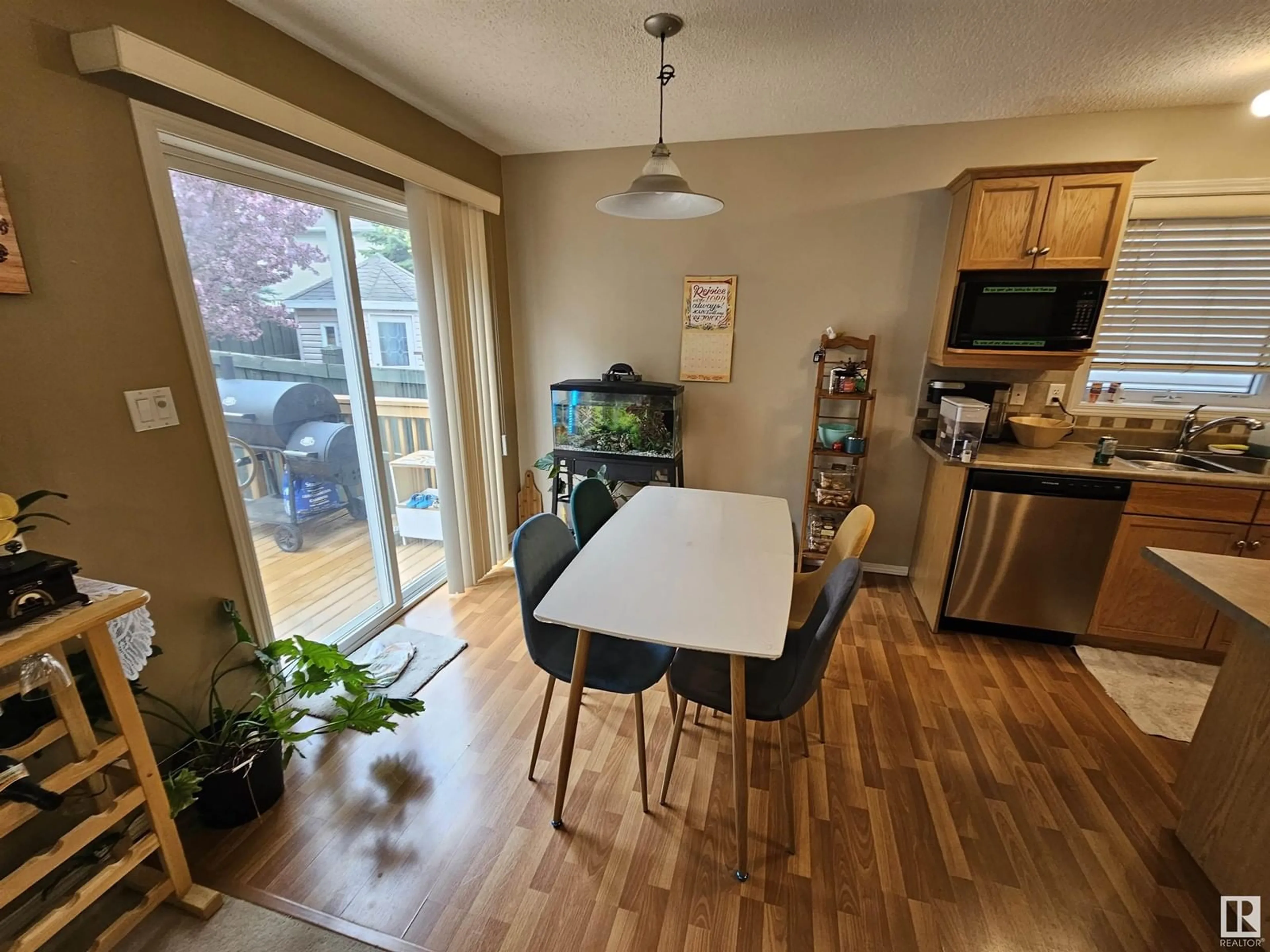 Open concept kitchen, wood/laminate floor for 2021 - 93 GRANTHAM CO, Edmonton Alberta T5T6V7