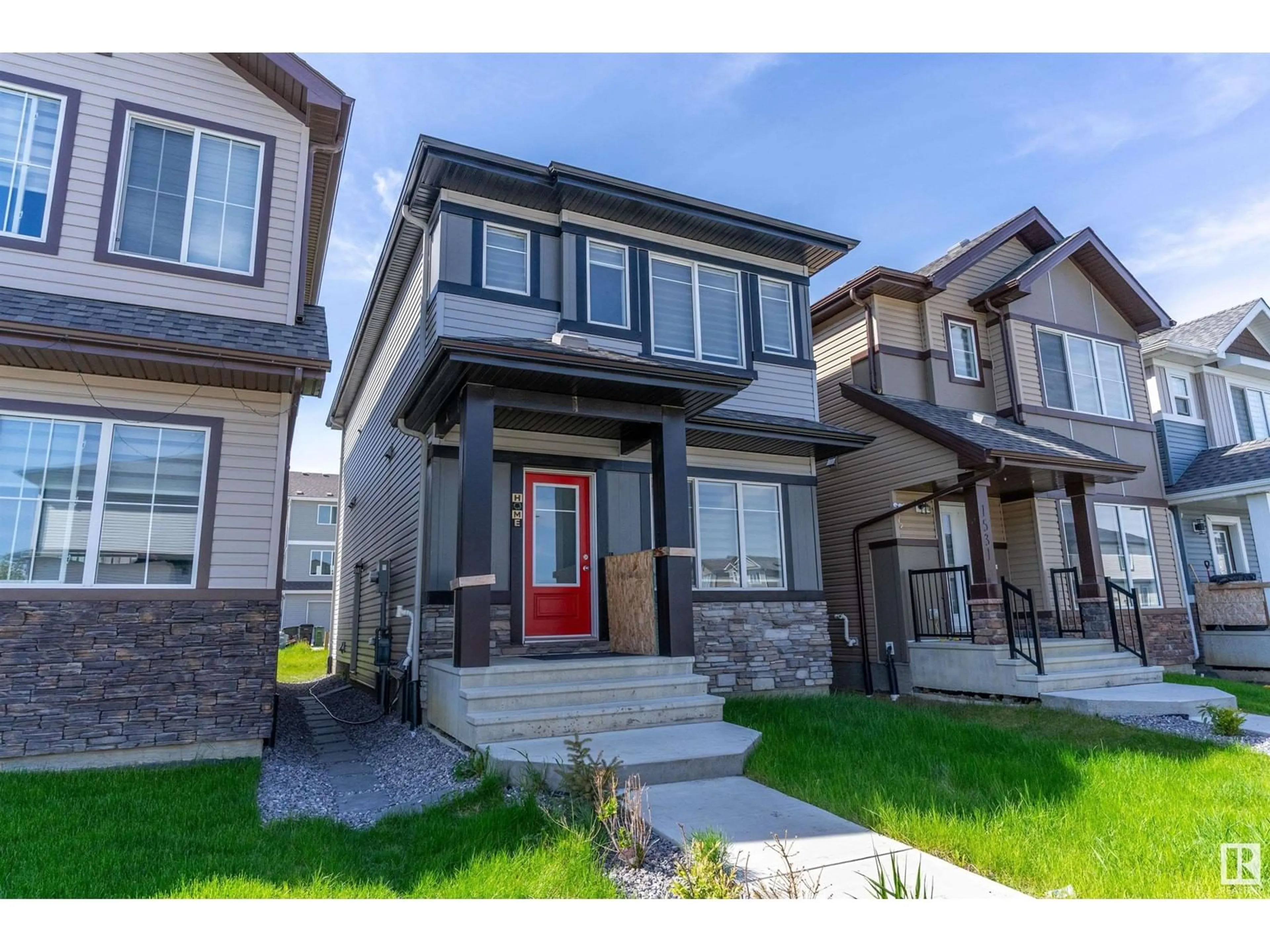 Home with vinyl exterior material, street for 1527 16 AV, Edmonton Alberta T6T2N9