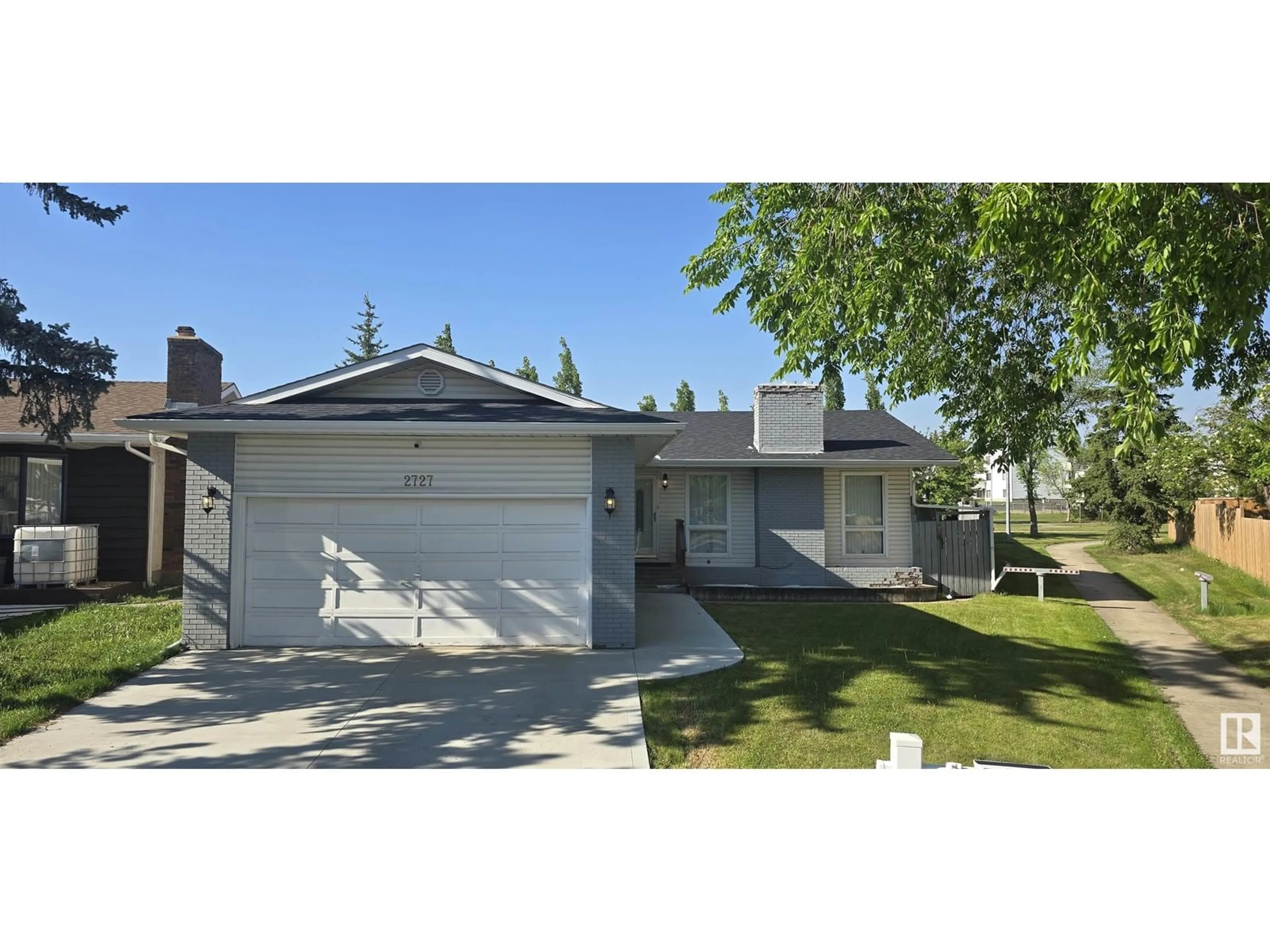 Home with vinyl exterior material, street for 2727 83 STREET, Edmonton Alberta T6K3G7