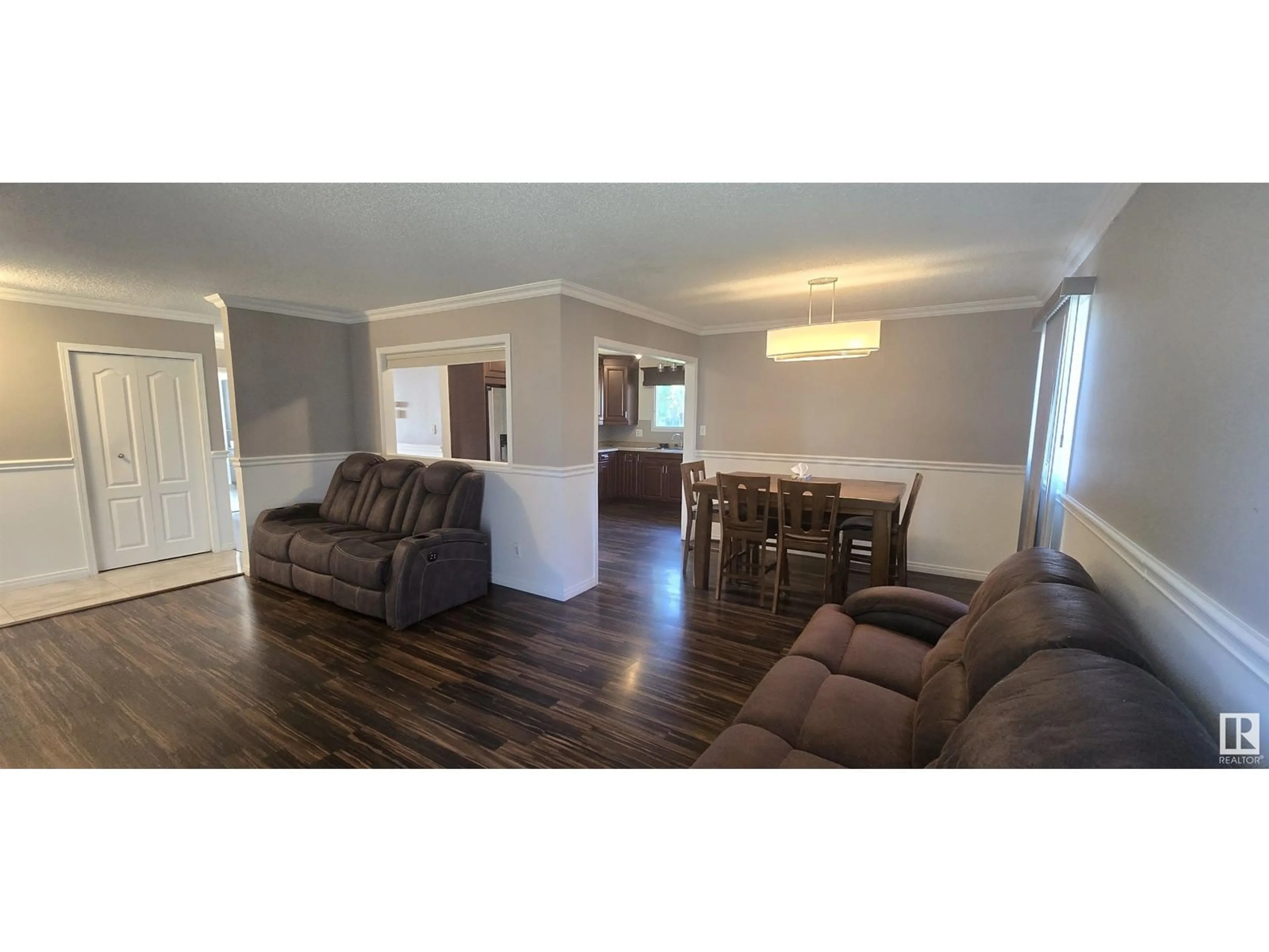 Living room with furniture, wood/laminate floor for 2727 83 STREET, Edmonton Alberta T6K3G7