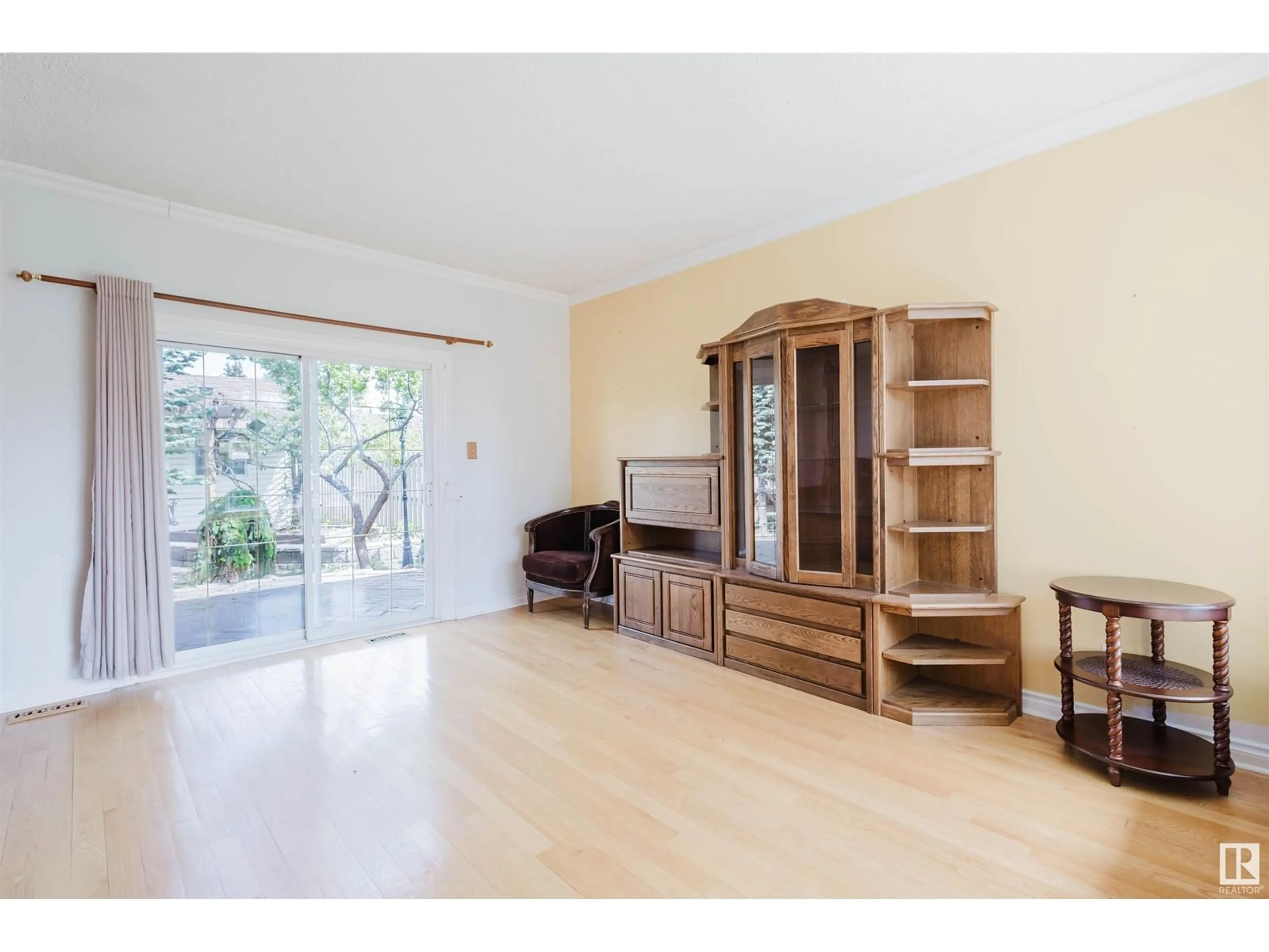 Living room with furniture, wood/laminate floor for NW - 1759 62 ST, Edmonton Alberta T6L1M7