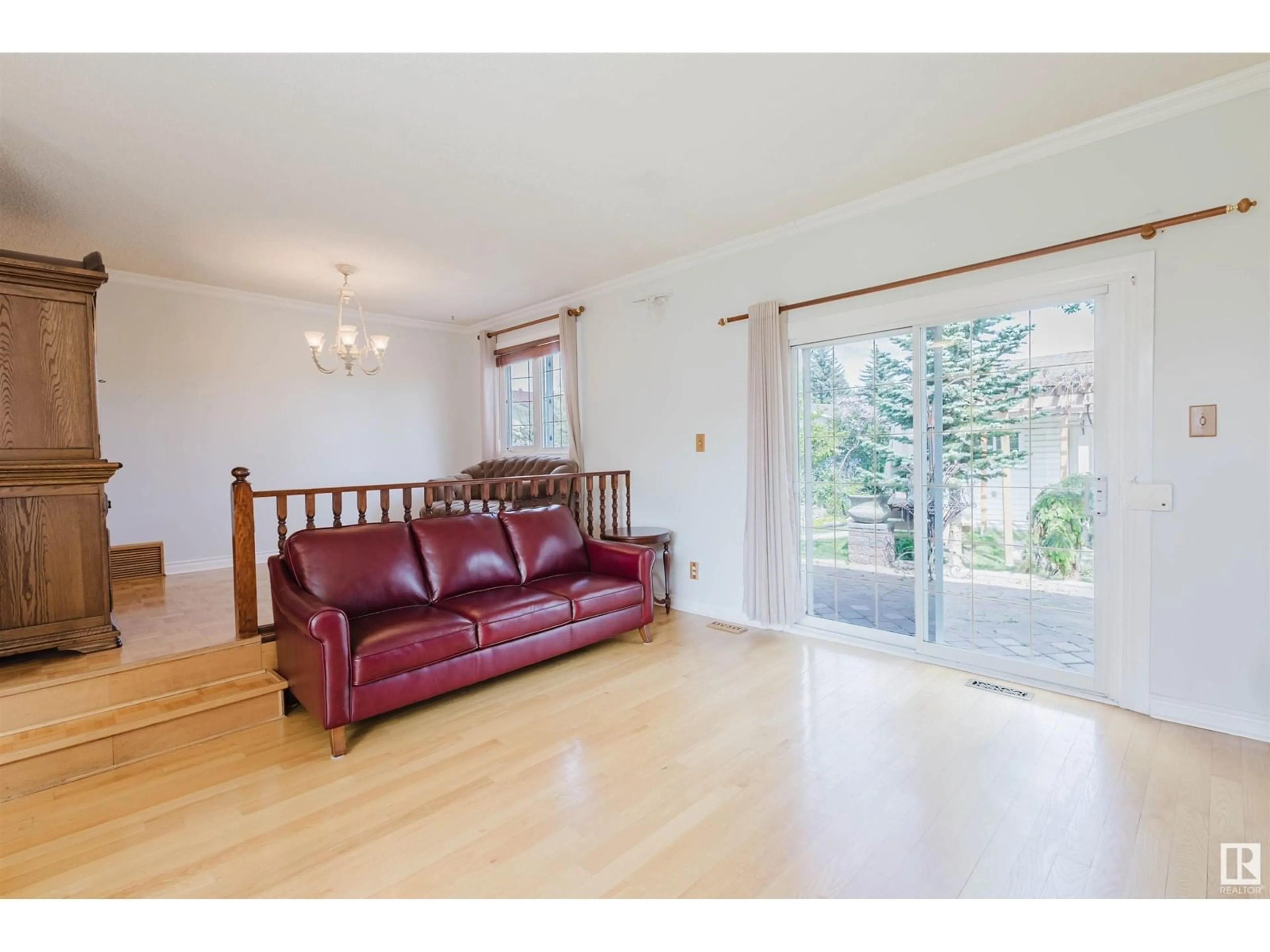 Living room with furniture, wood/laminate floor for NW - 1759 62 ST, Edmonton Alberta T6L1M7