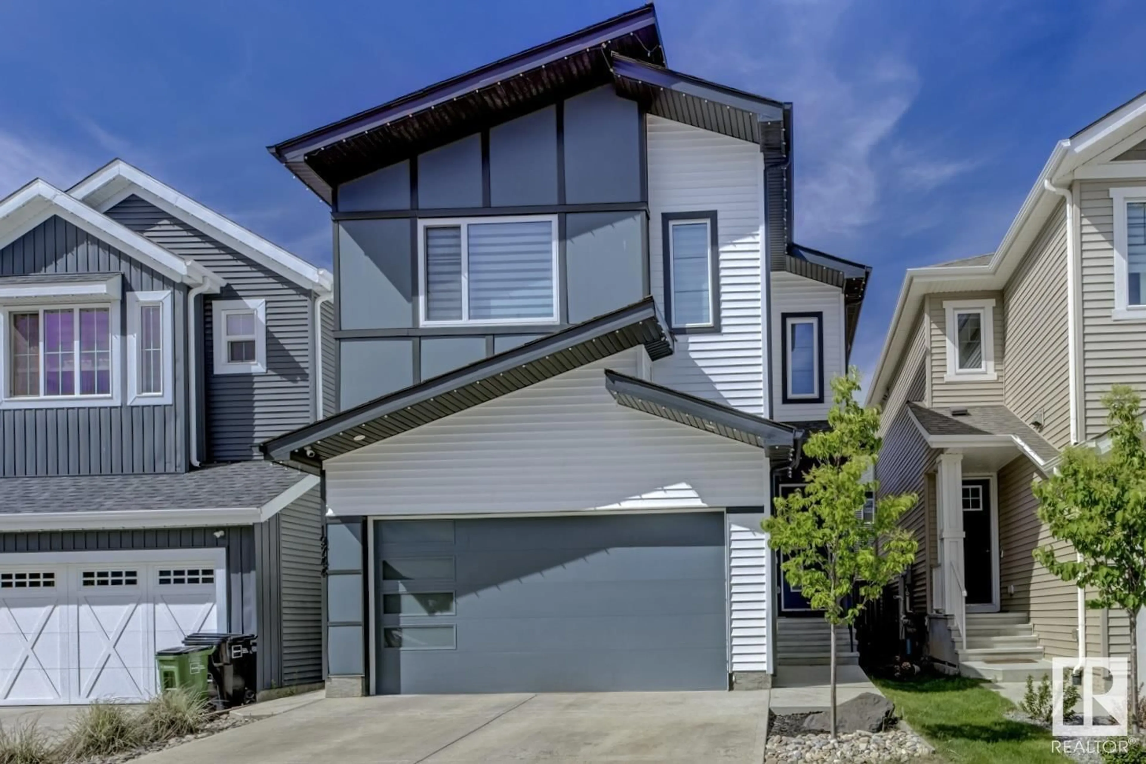 Home with vinyl exterior material, street for 19744 28 AV, Edmonton Alberta T6M1M1