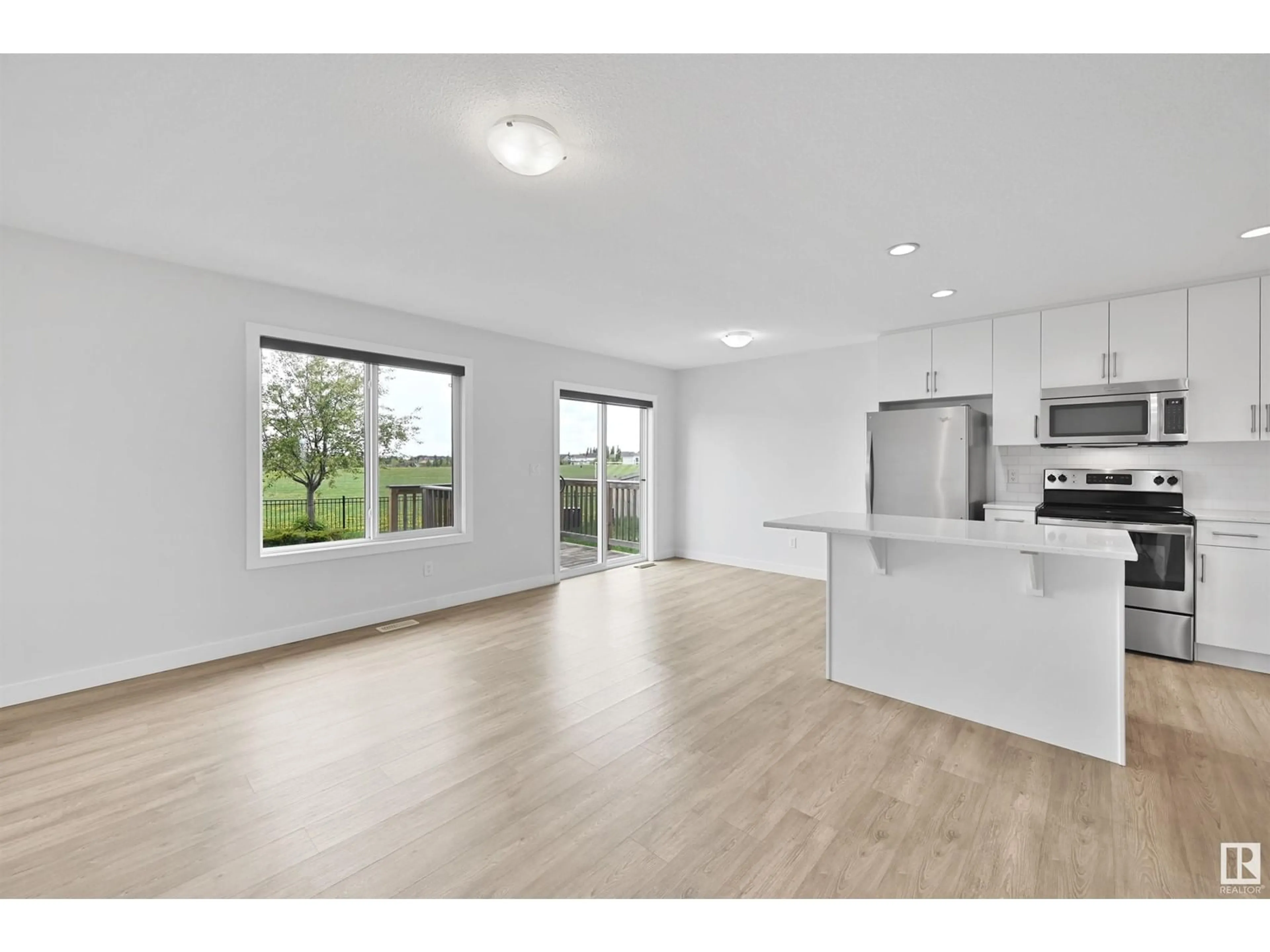 Open concept kitchen, wood/laminate floor for 7090 SOUTH TERWILLEGAR DR, Edmonton Alberta T6R0V1