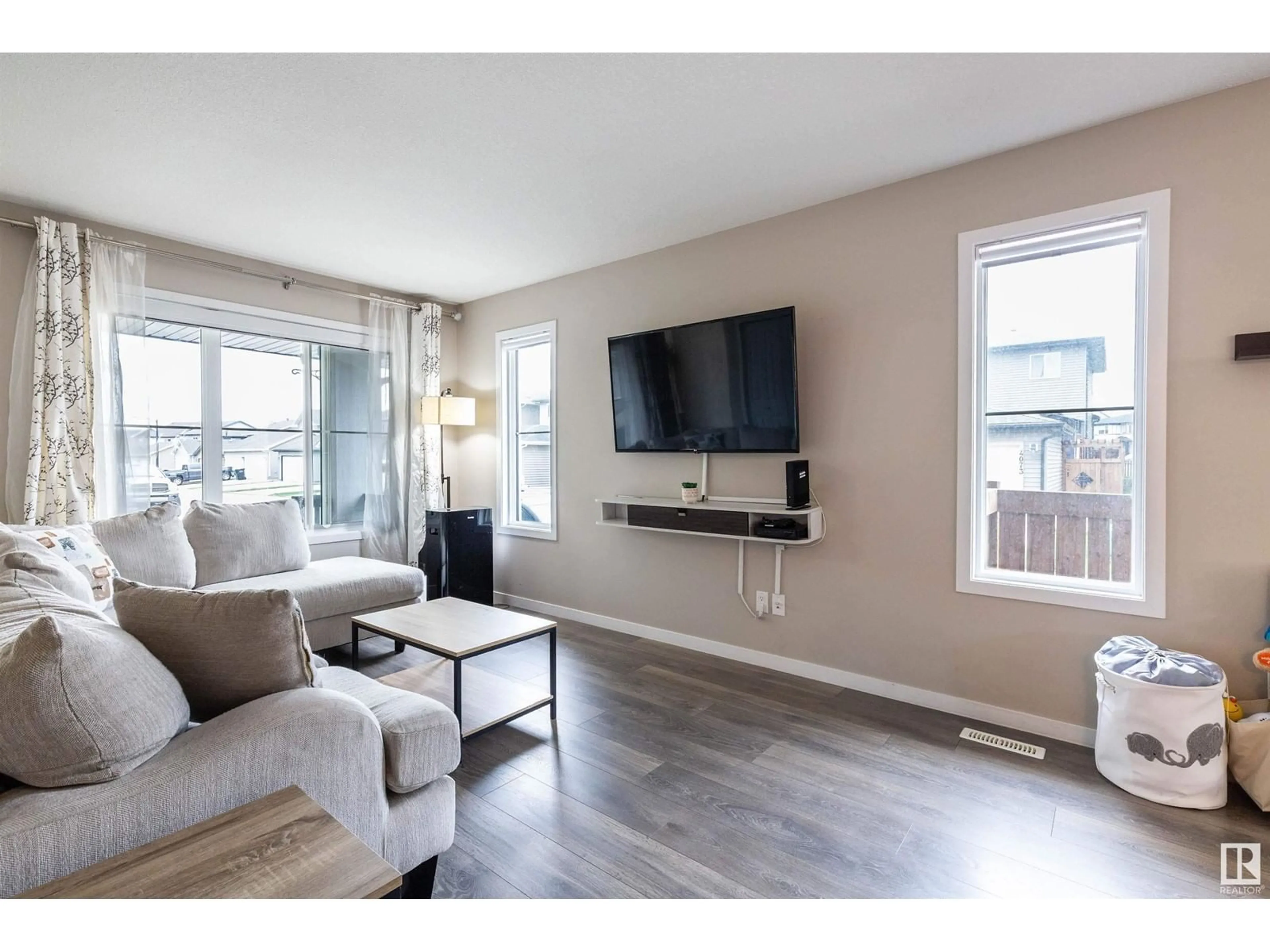 Living room with furniture, wood/laminate floor for LI SW - 4325 PROWSE LINK, Edmonton Alberta T6W3A7