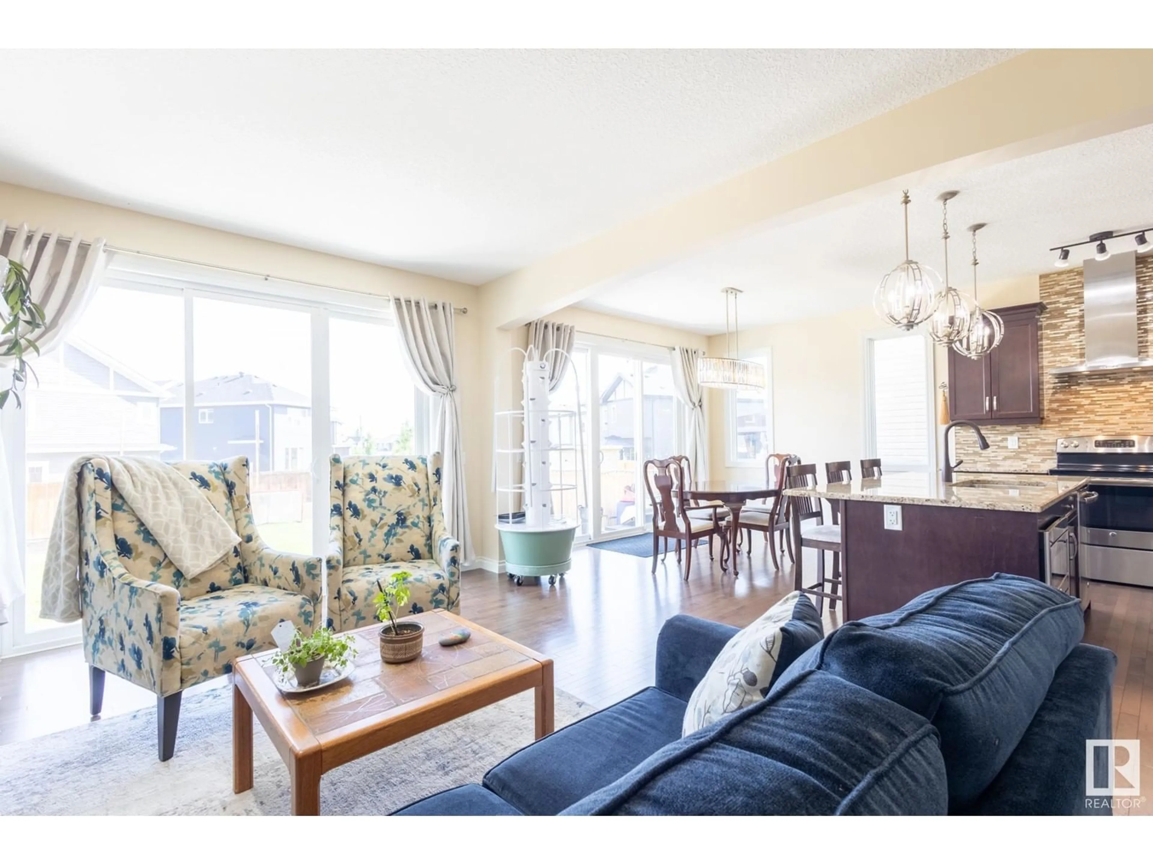 Living room with furniture, wood/laminate floor for 20820 130 AV, Edmonton Alberta T5S0L4
