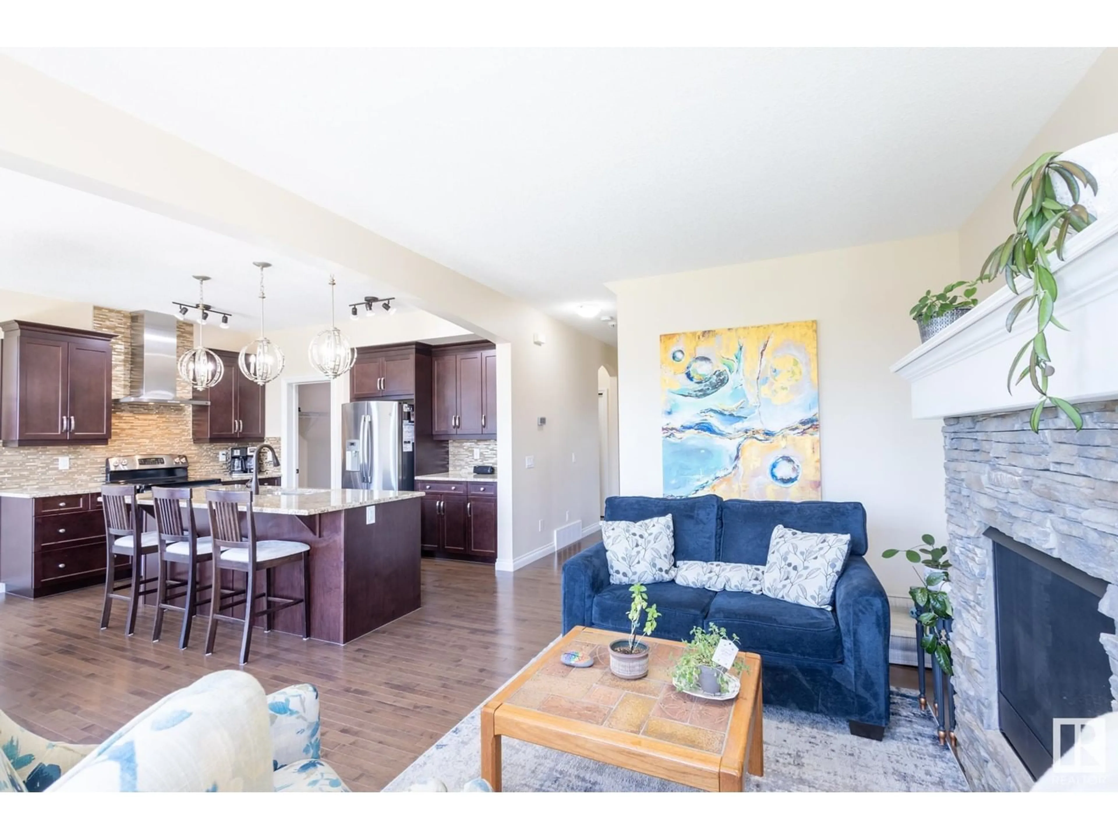 Living room with furniture, wood/laminate floor for 20820 130 AV, Edmonton Alberta T5S0L4