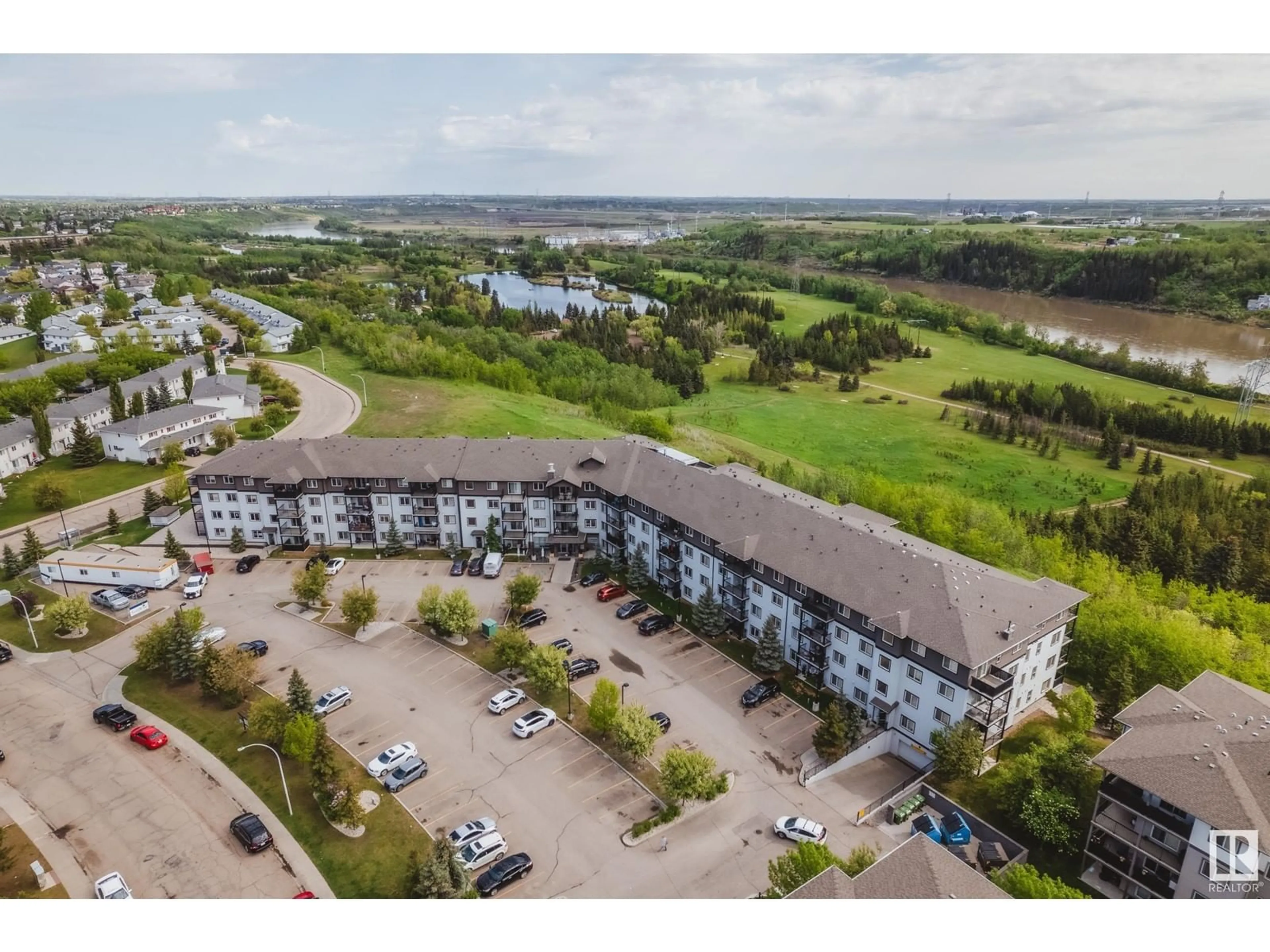 A pic from outside/outdoor area/front of a property/back of a property/a pic from drone, water/lake/river/ocean view for NW - 266 1196 HYNDMAN RD, Edmonton Alberta T5A0P8
