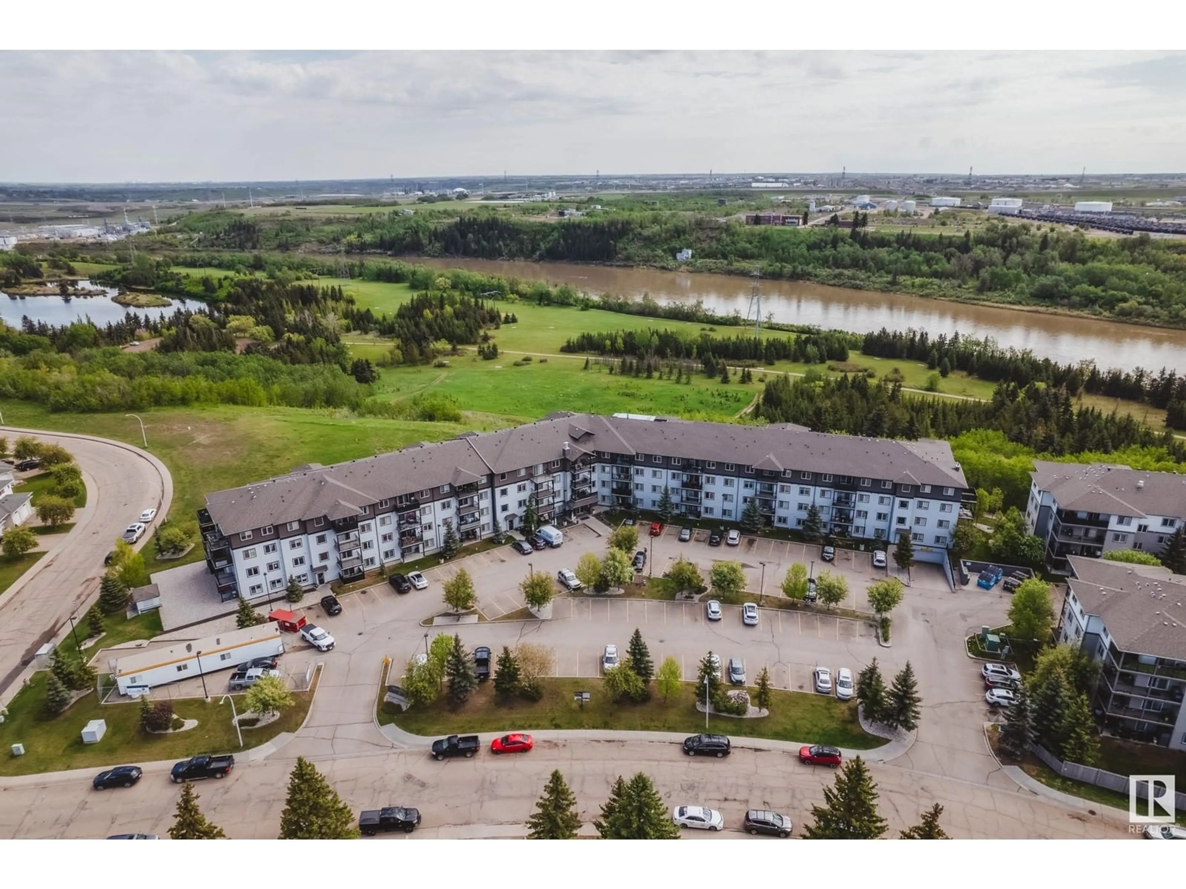 A pic from outside/outdoor area/front of a property/back of a property/a pic from drone, water/lake/river/ocean view for NW - 266 1196 HYNDMAN RD, Edmonton Alberta T5A0P8