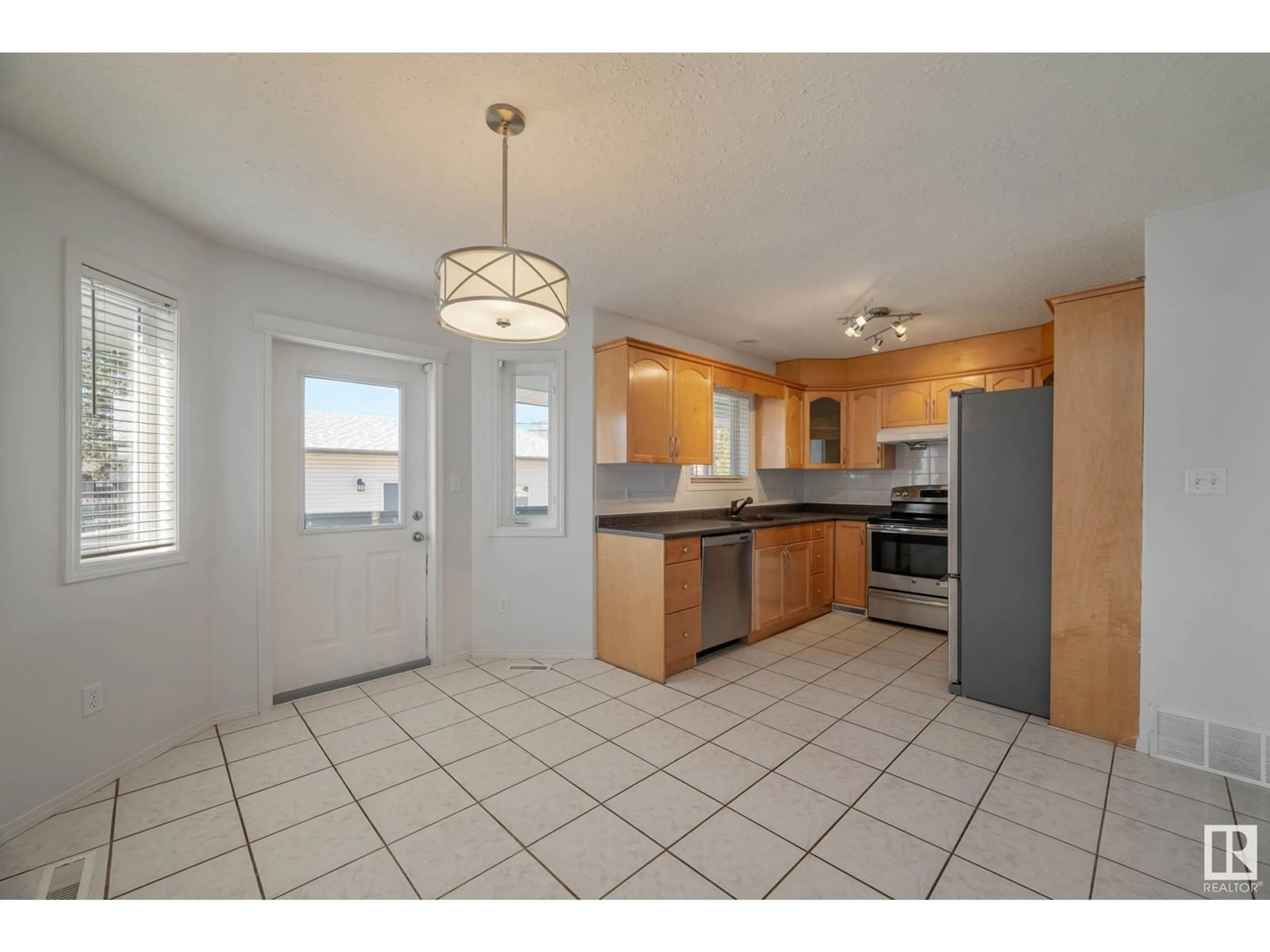 Open concept kitchen, ceramic/tile floor for NW - 12816 72 ST, Edmonton Alberta T5C0P5