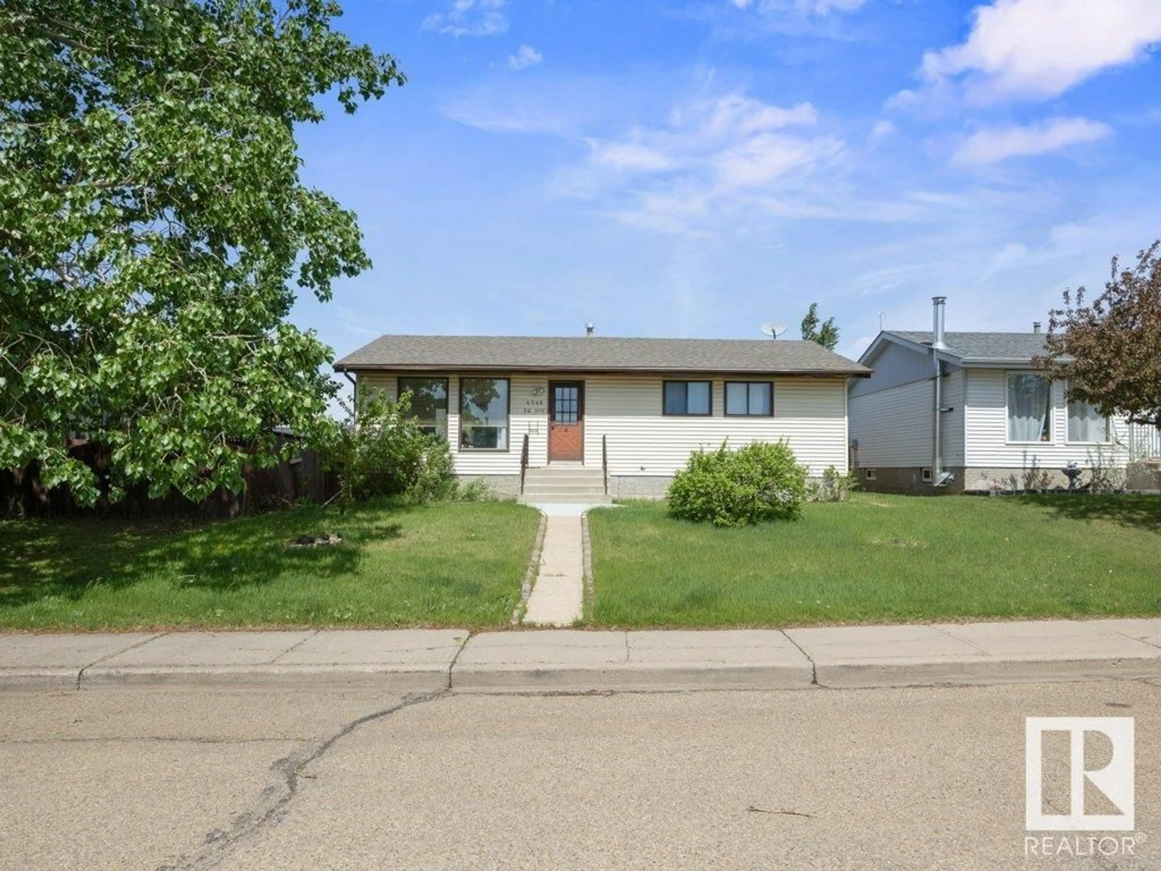 Home with vinyl exterior material, street for 4346 54 AV, Tofield Alberta T0B4J0