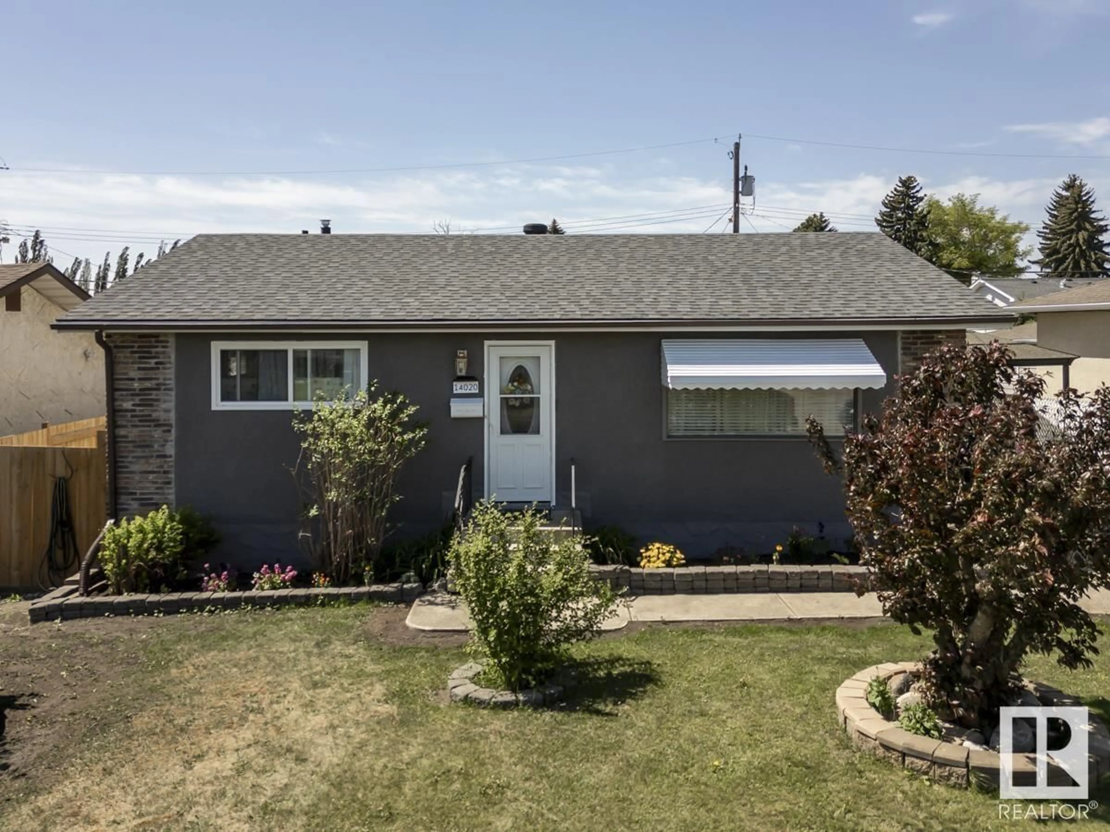 Home with vinyl exterior material, street for NW - 14020 58 ST, Edmonton Alberta T5A1N4