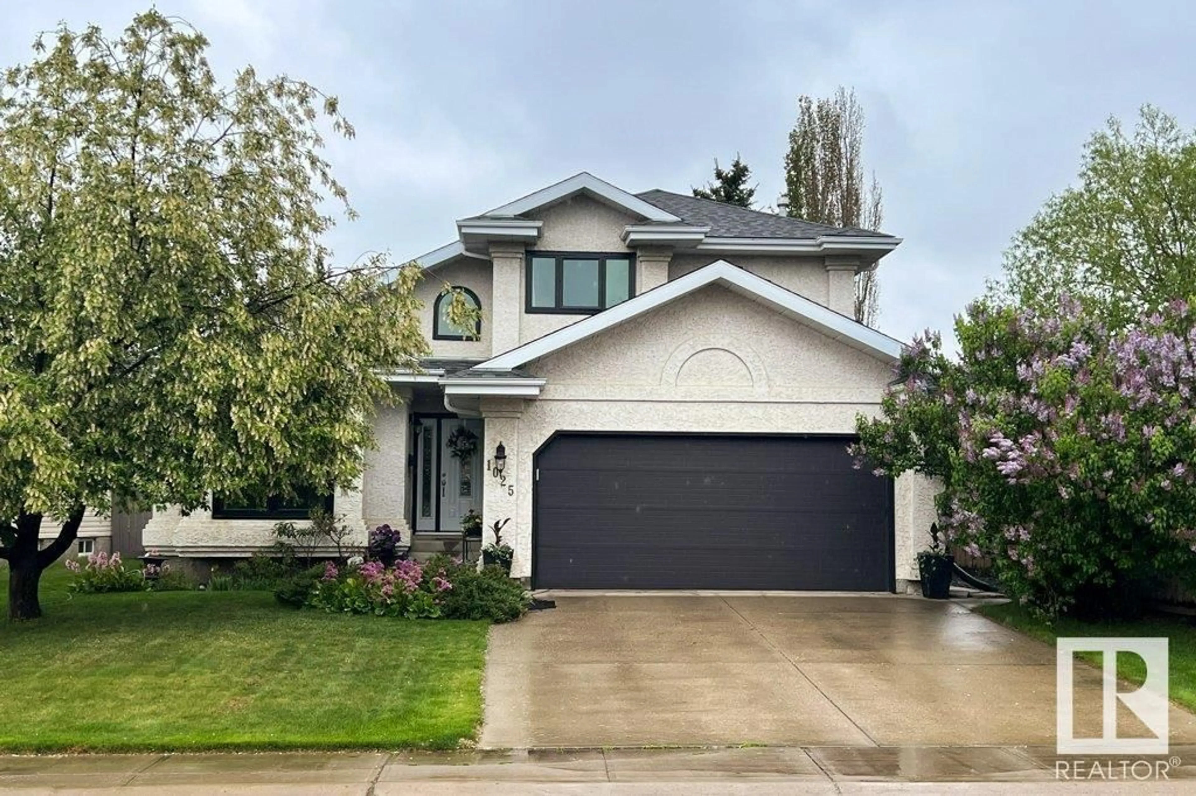 Home with vinyl exterior material, street for NW - 1025 112 ST, Edmonton Alberta T6J6S1
