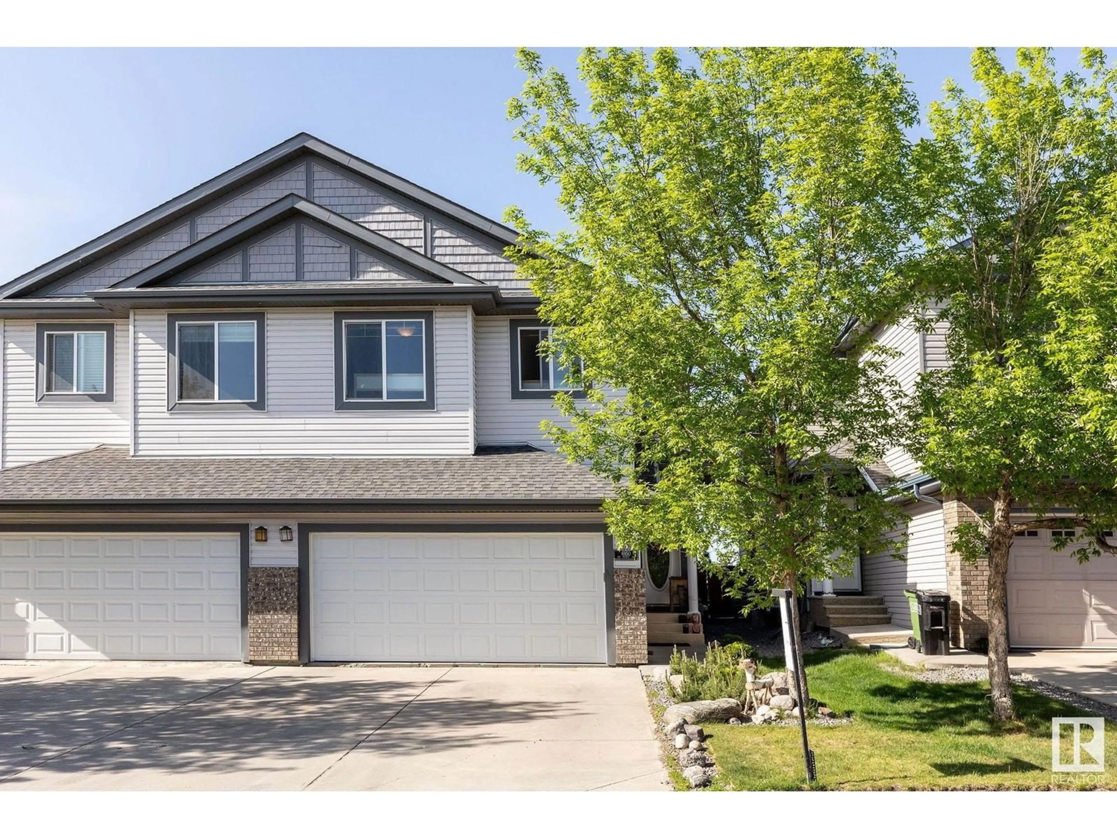 Home with vinyl exterior material, street for 6950 19A AV, Edmonton Alberta T6X0L7