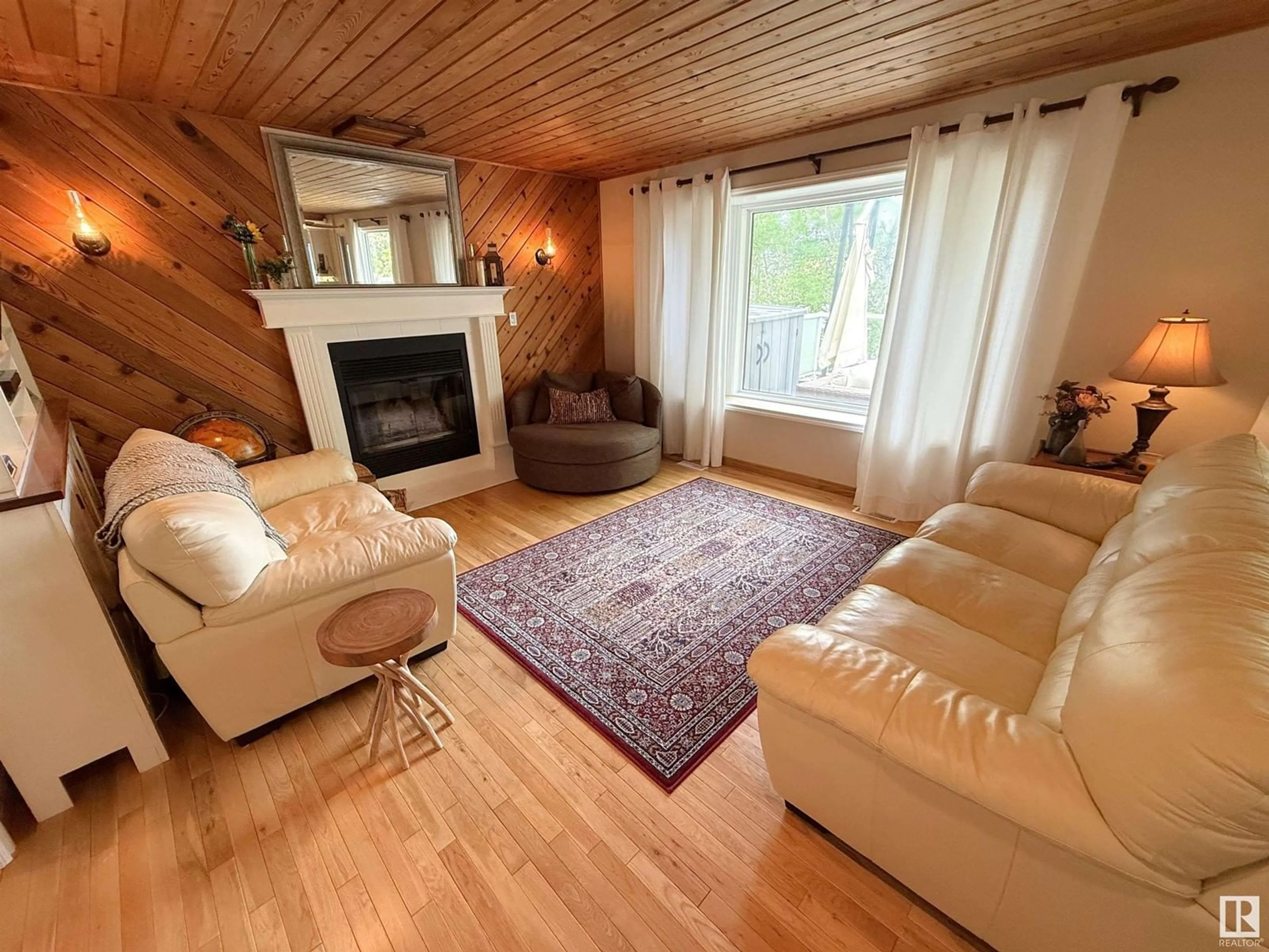 Living room with furniture, wood/laminate floor for 37 - 2304 TWP ROAD 522, Rural Parkland County Alberta T7Y2J7