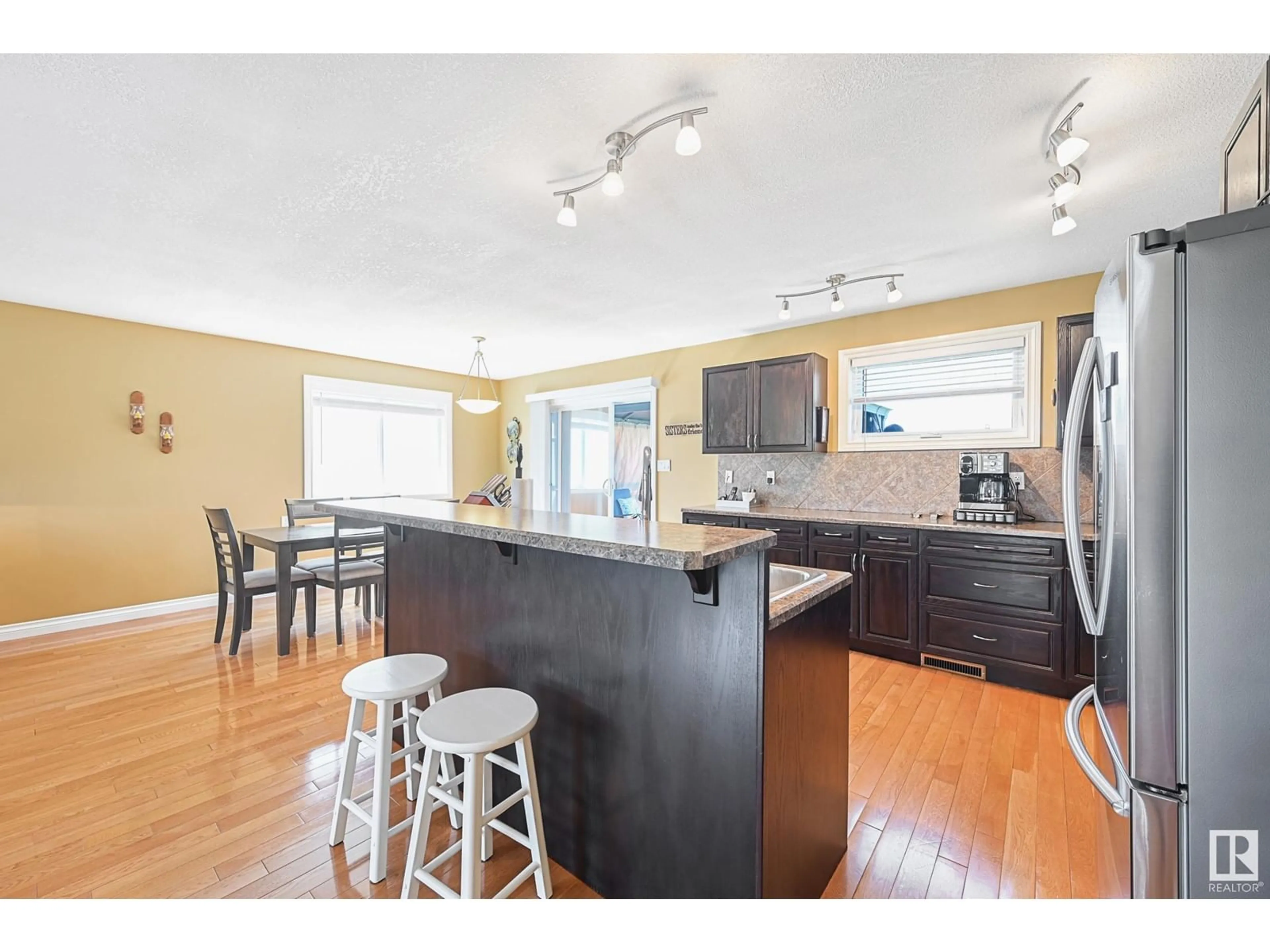 Open concept kitchen, wood/laminate floor for 528 6 ST, Thorhild Alberta T0A3J0