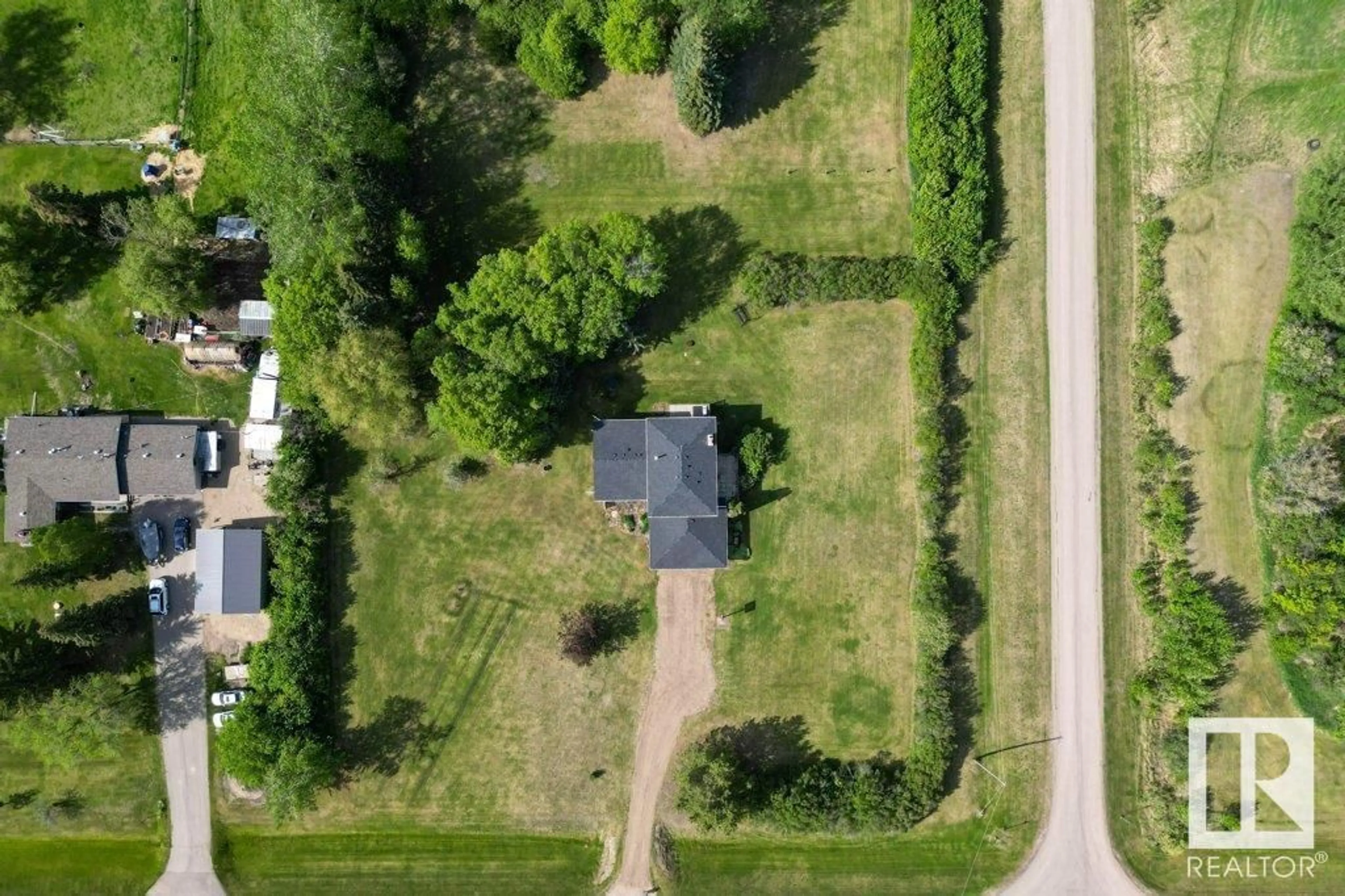 A pic from outside/outdoor area/front of a property/back of a property/a pic from drone, street for 14 - 53111 RGE ROAD 220, Rural Strathcona County Alberta T8E2C6