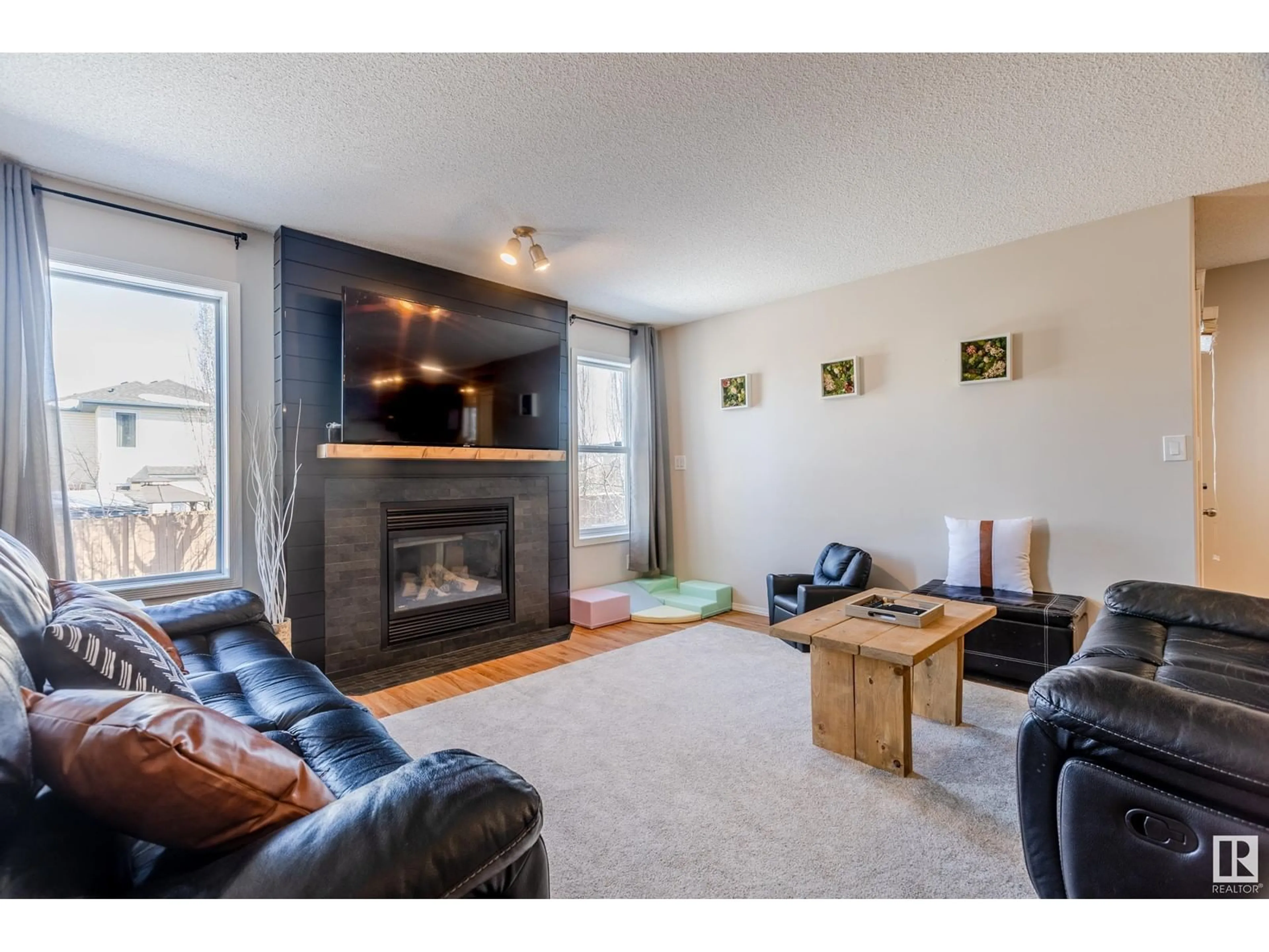 Living room with furniture, wood/laminate floor for 12 VAUGHN AV, Spruce Grove Alberta T7X4M6