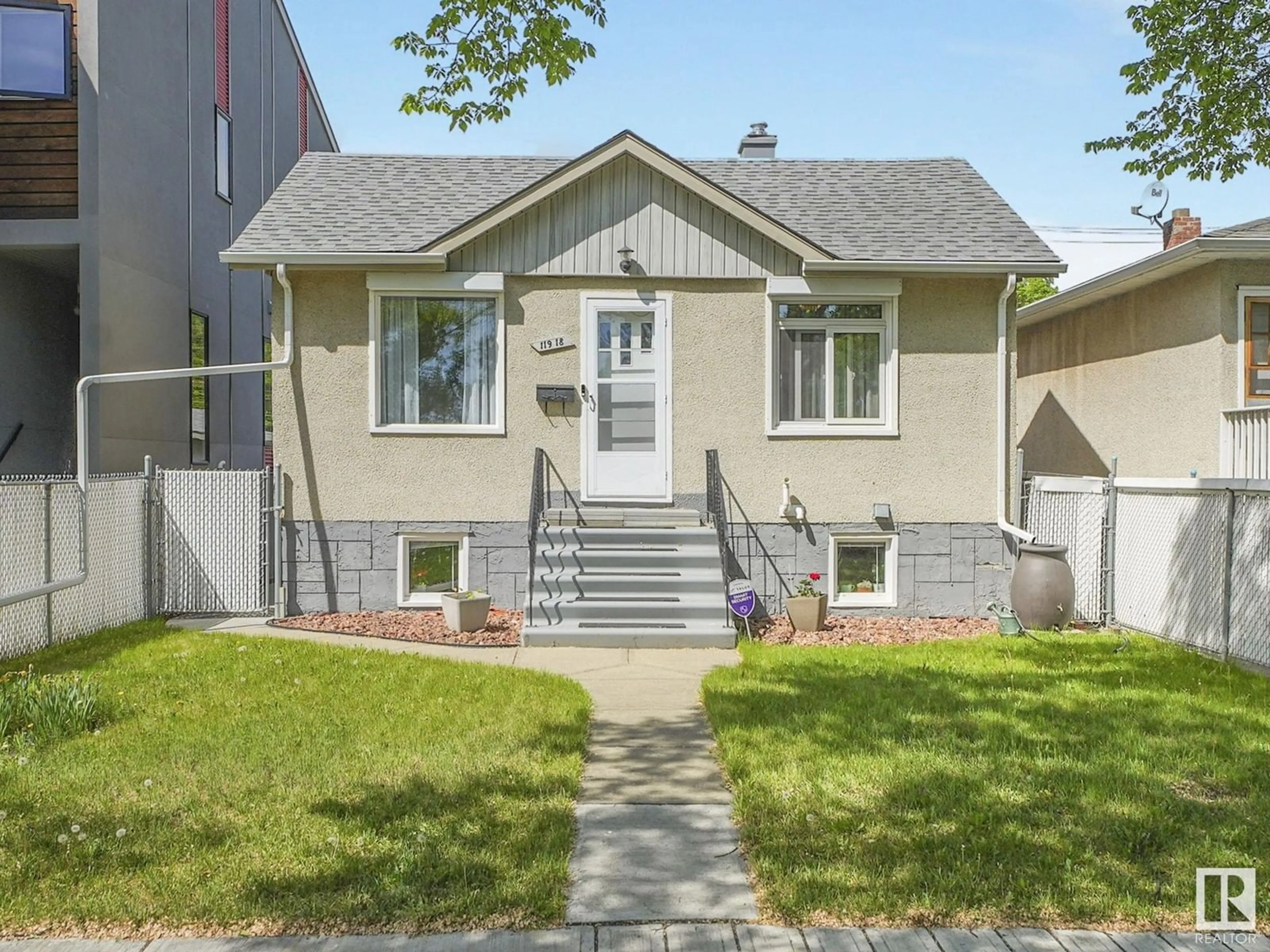 Home with vinyl exterior material, street for 11918 76 ST, Edmonton Alberta T5B2C7