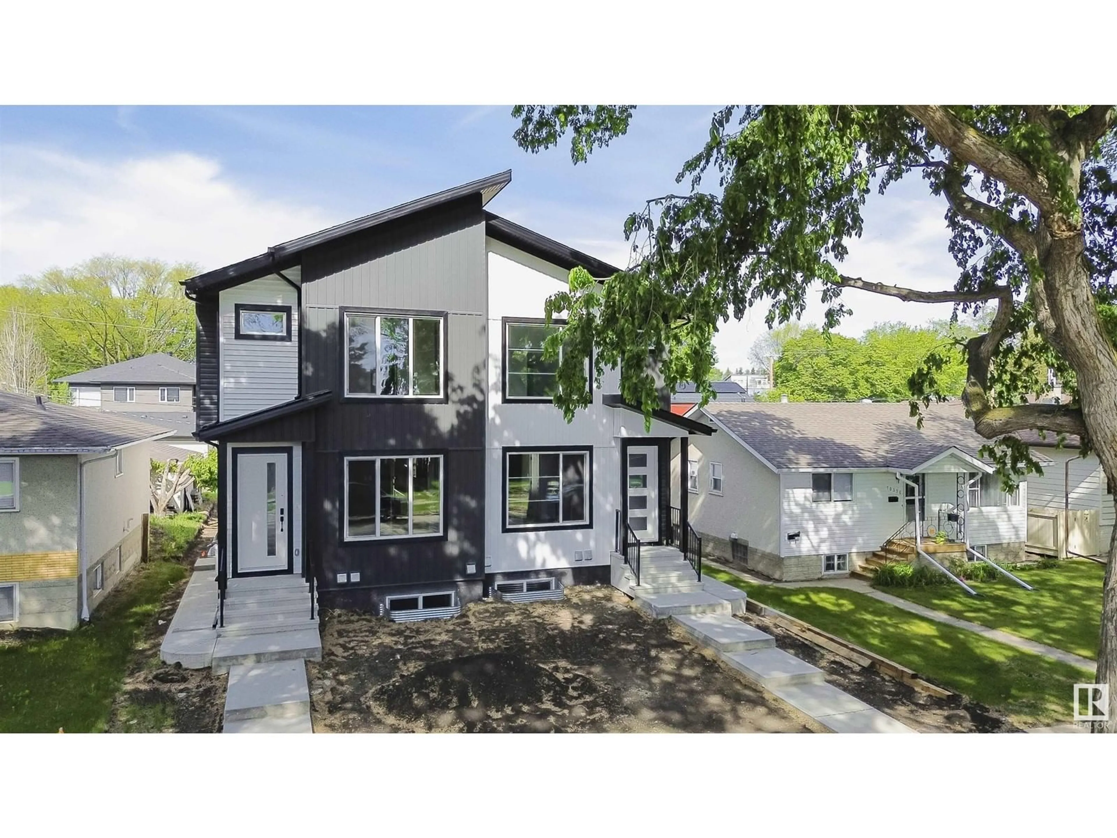 Home with vinyl exterior material, street for NW - 10332 77 ST, Edmonton Alberta T6A3C3