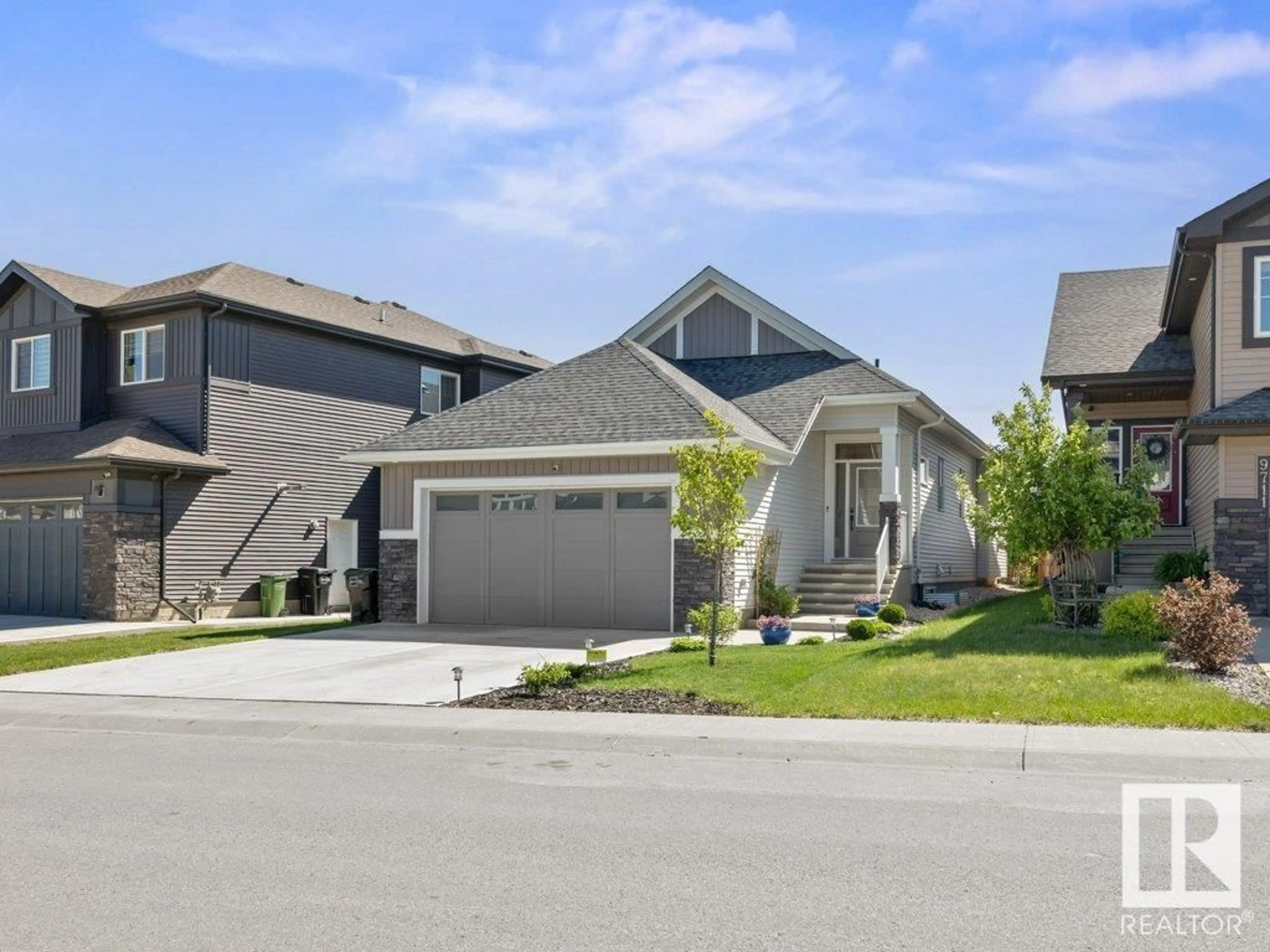 Home with vinyl exterior material, street for NW - 9715 223 ST, Edmonton Alberta T5T7B7
