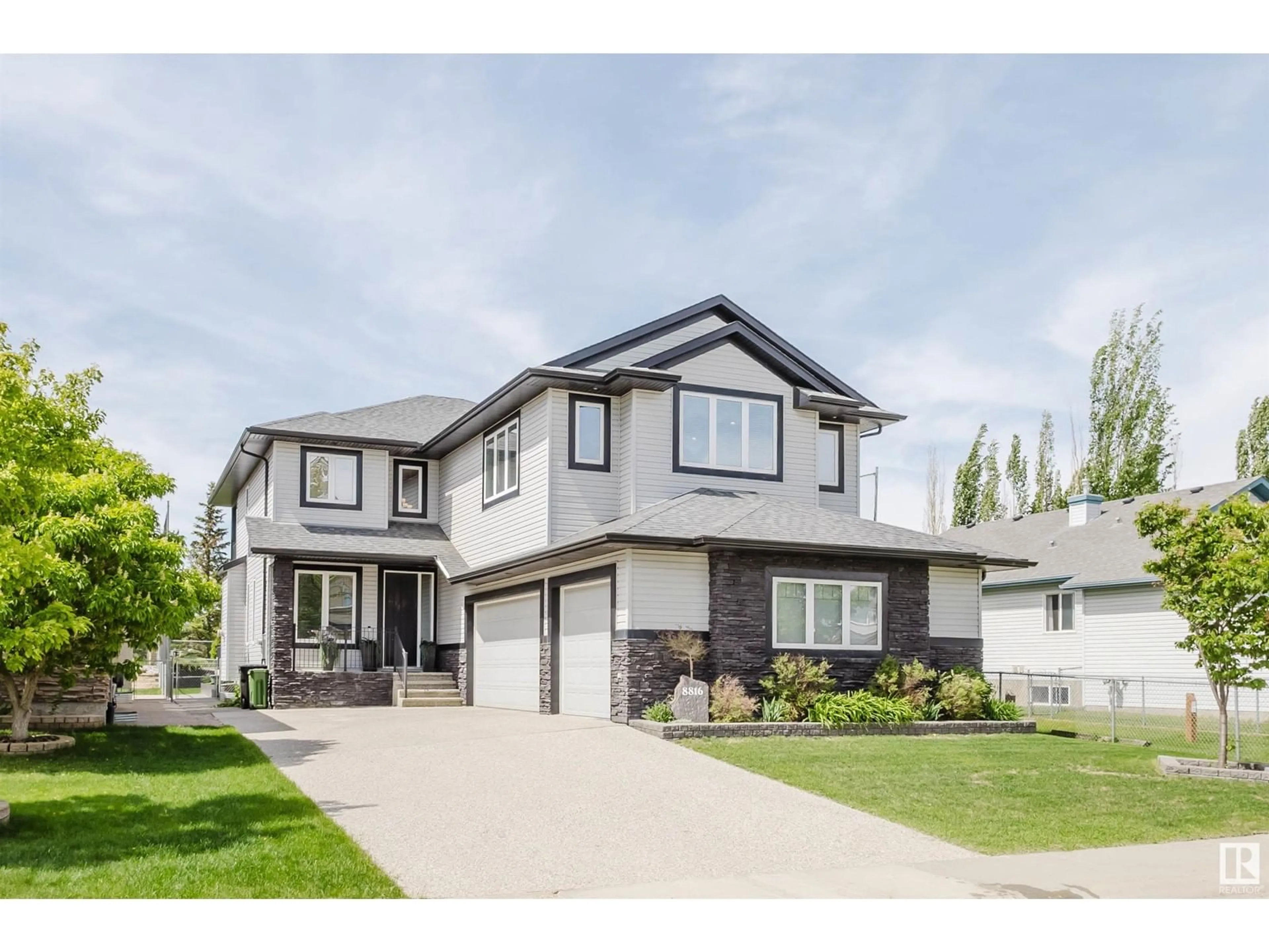 Home with vinyl exterior material, street for NW - 8816 208 ST, Edmonton Alberta T5T6Y3