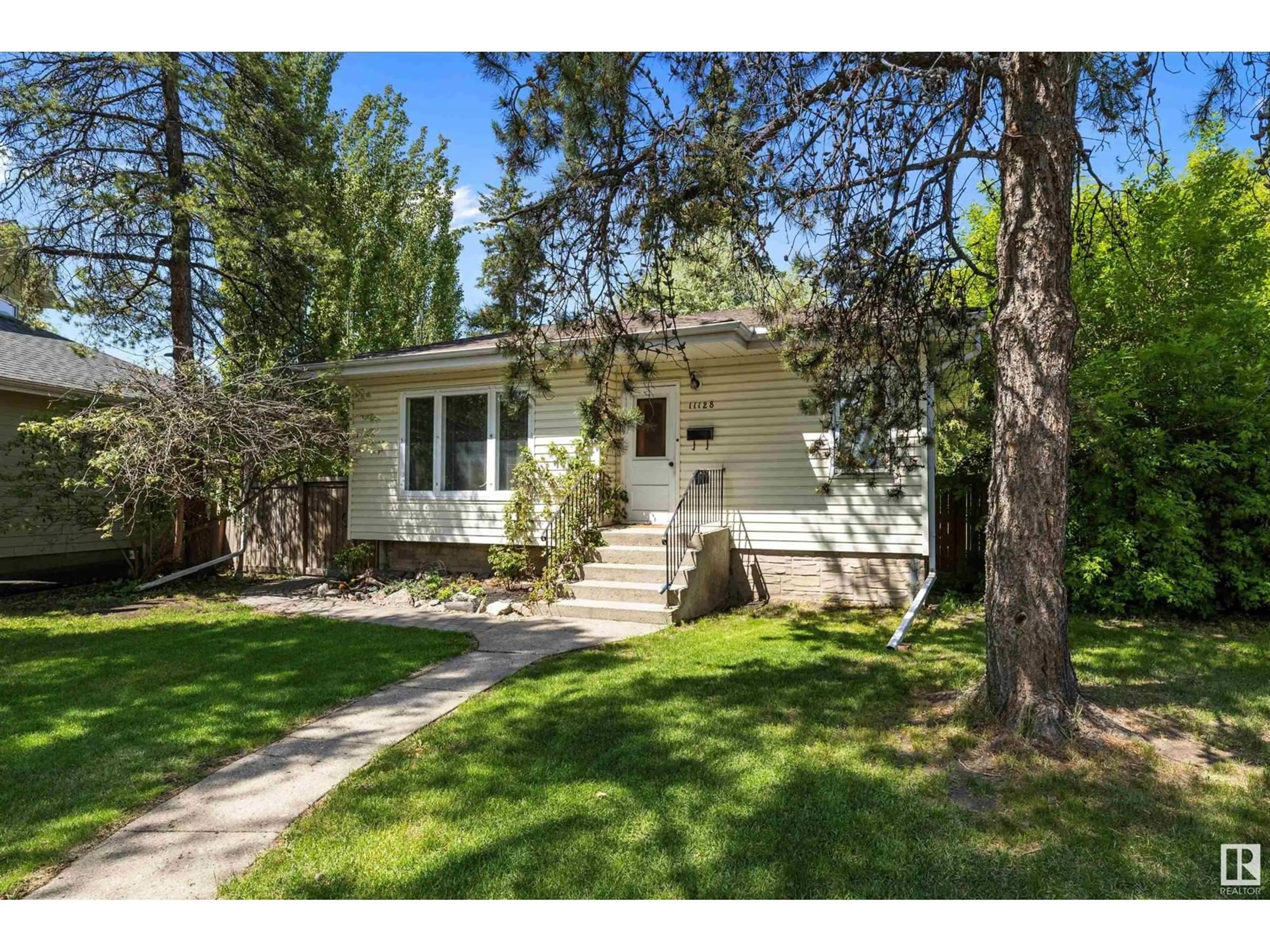 Home with vinyl exterior material, street for 11128 75 AV, Edmonton Alberta T6G0H2
