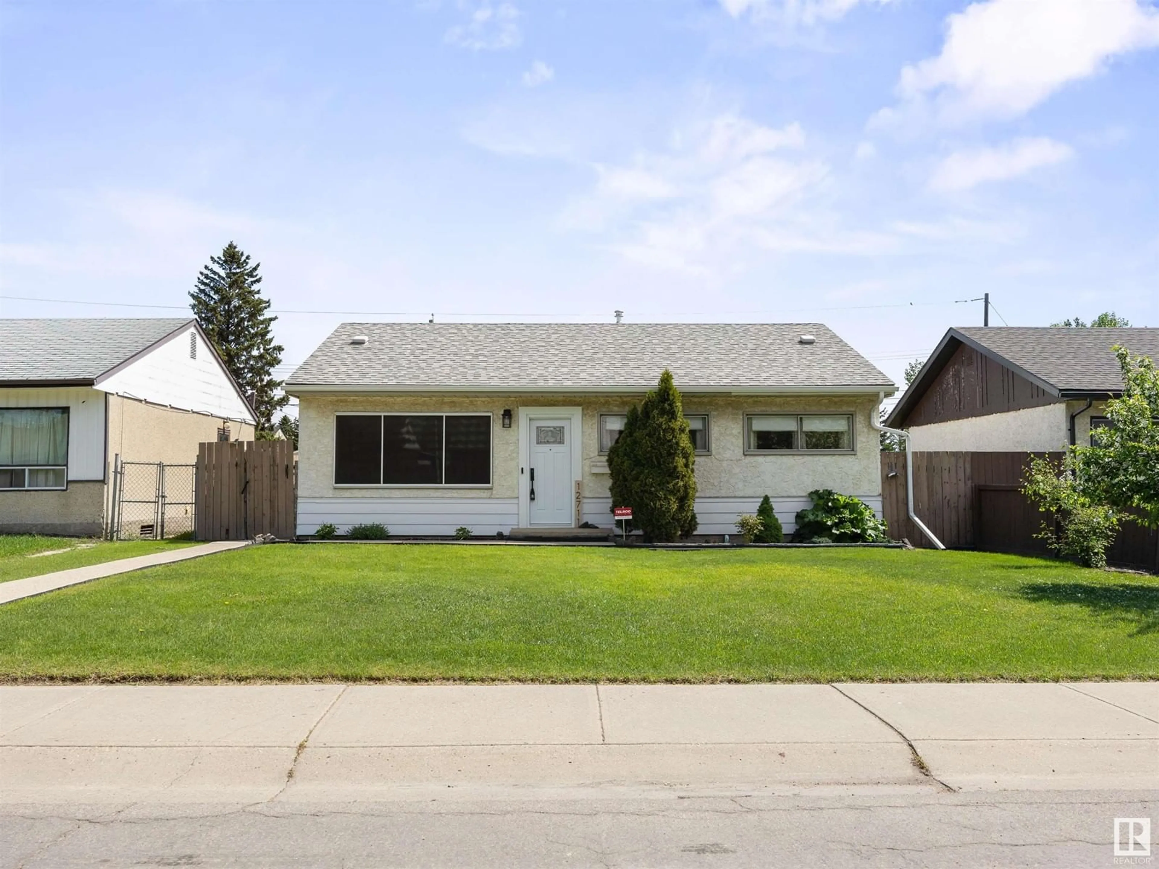 Home with vinyl exterior material, street for NW - 12711 135 ST, Edmonton Alberta T5L1Y3