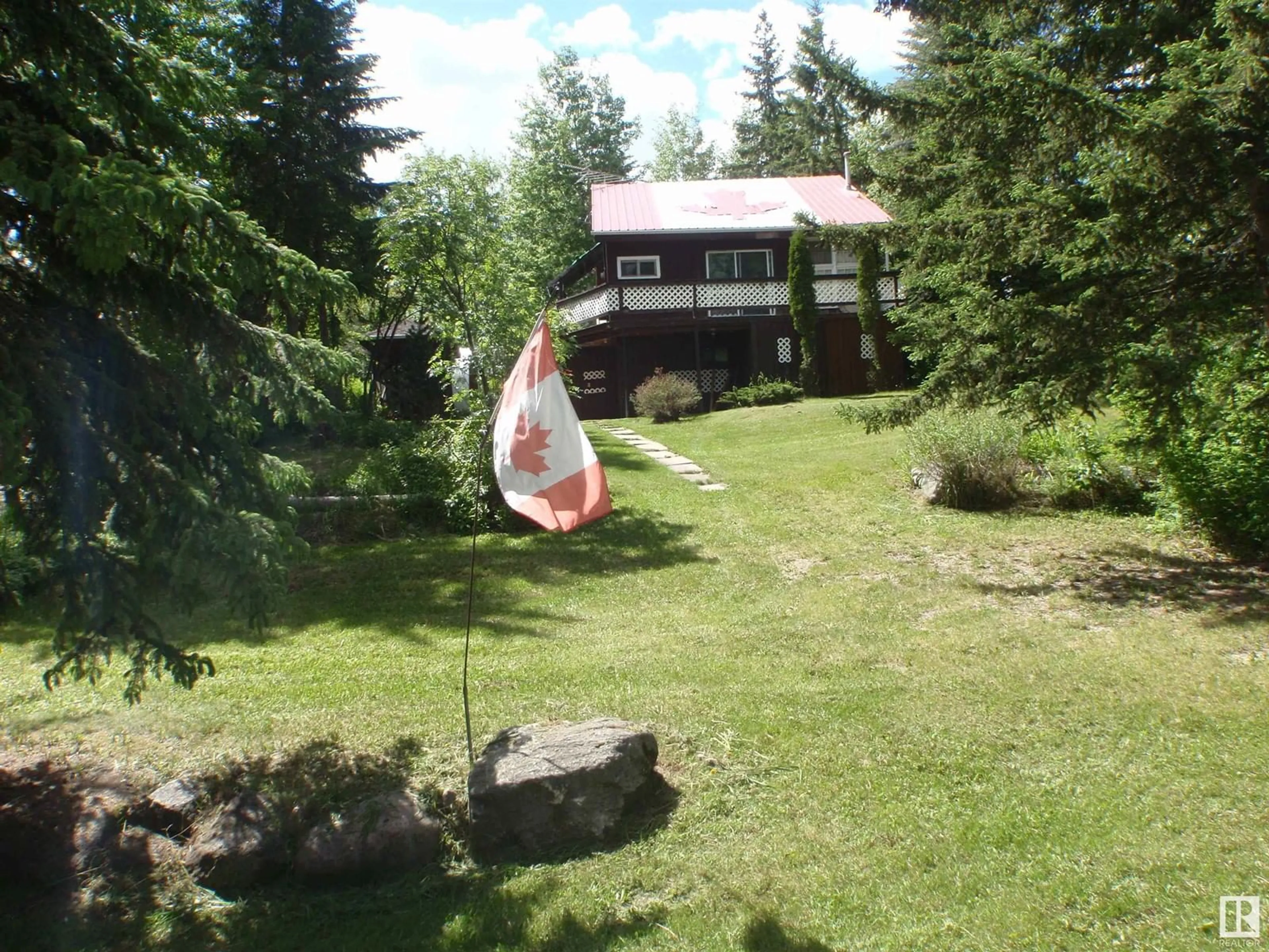 A pic from outside/outdoor area/front of a property/back of a property/a pic from drone, mountain view for 154 - 5415 TWP RD 594, Rural Barrhead County Alberta T7N1N3