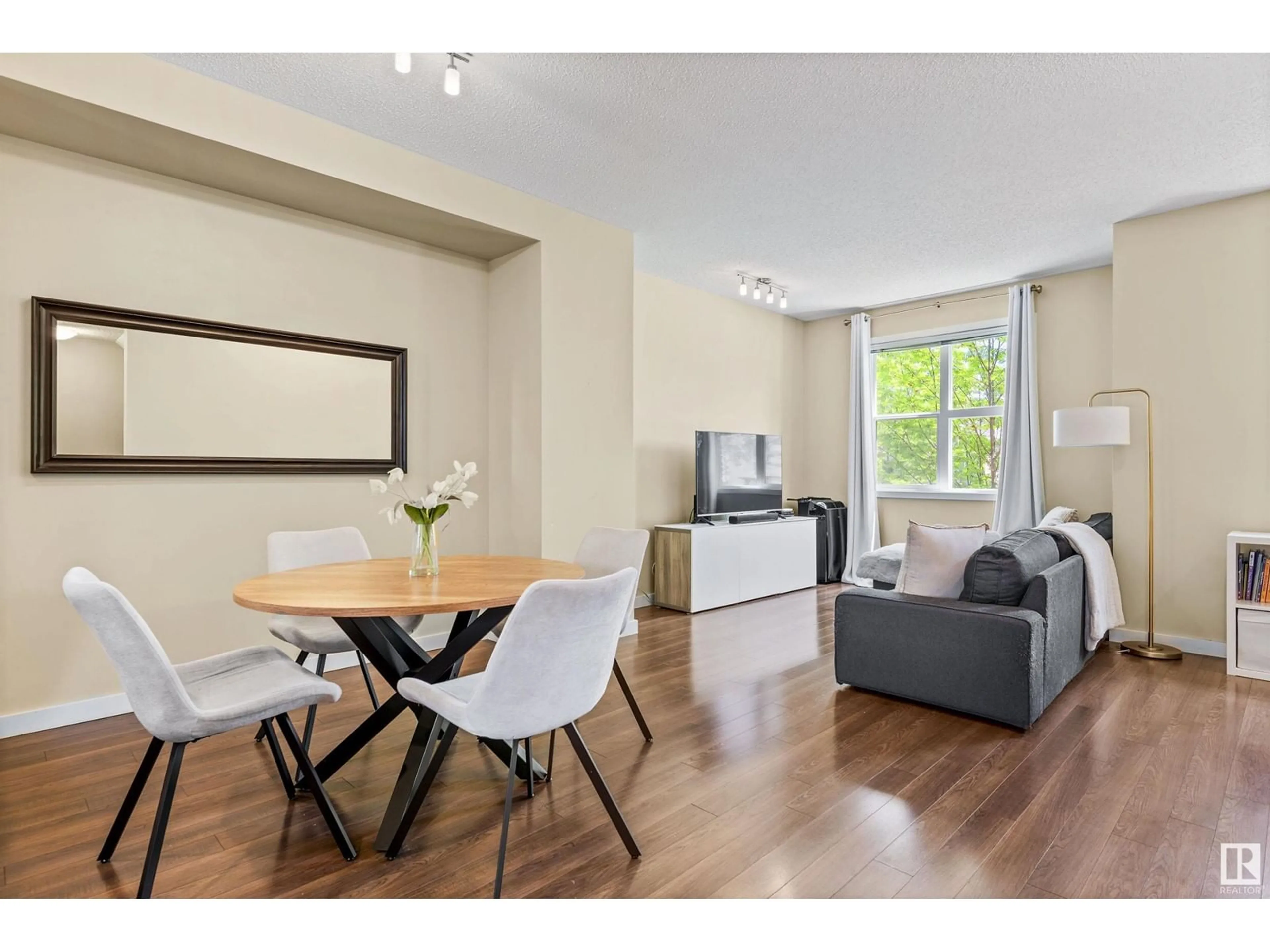 Living room with furniture, wood/laminate floor for 7 - 655 WATT BV, Edmonton Alberta T6X0Y2